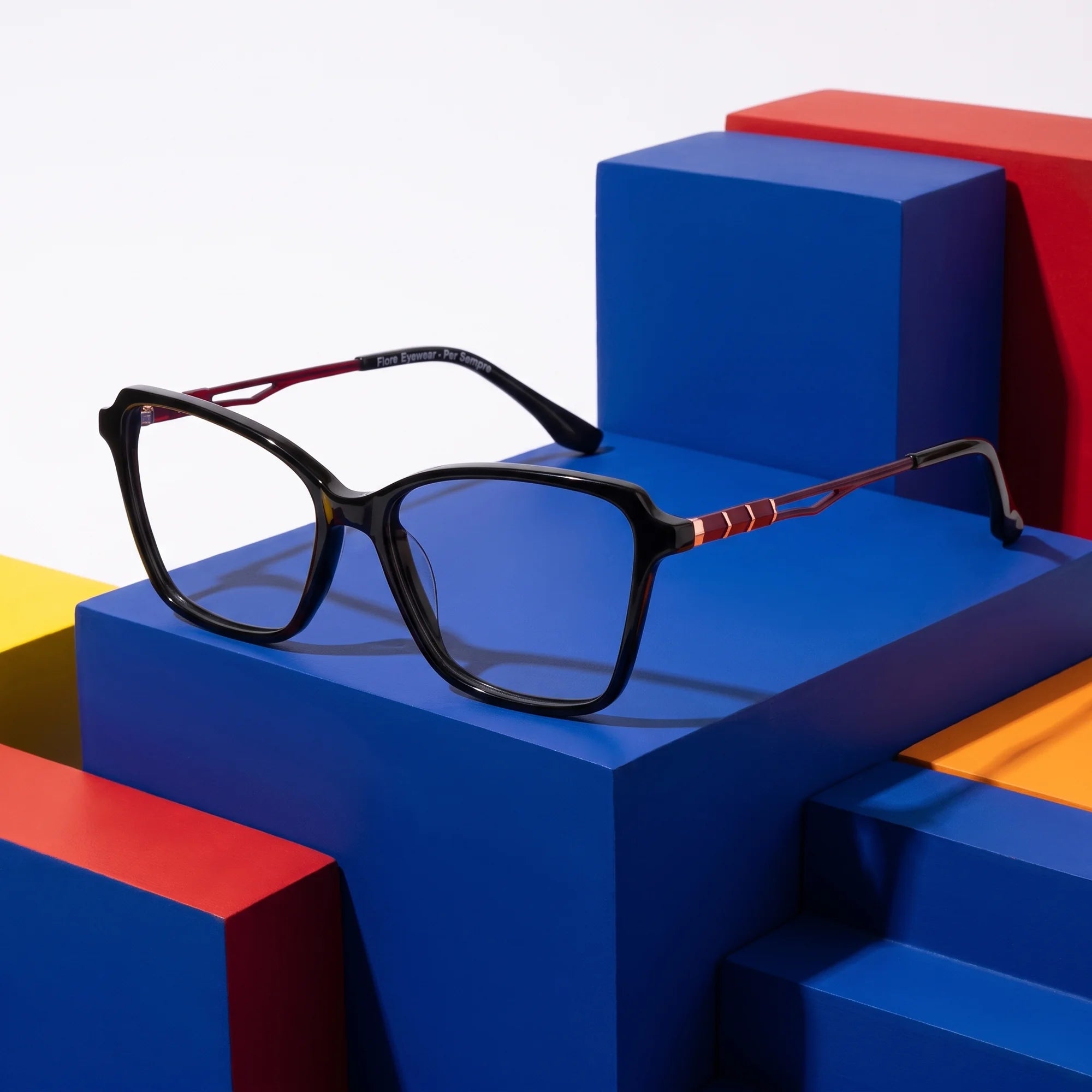 Fiore 1006 eyeglasses in black – on bold primary color-block steps