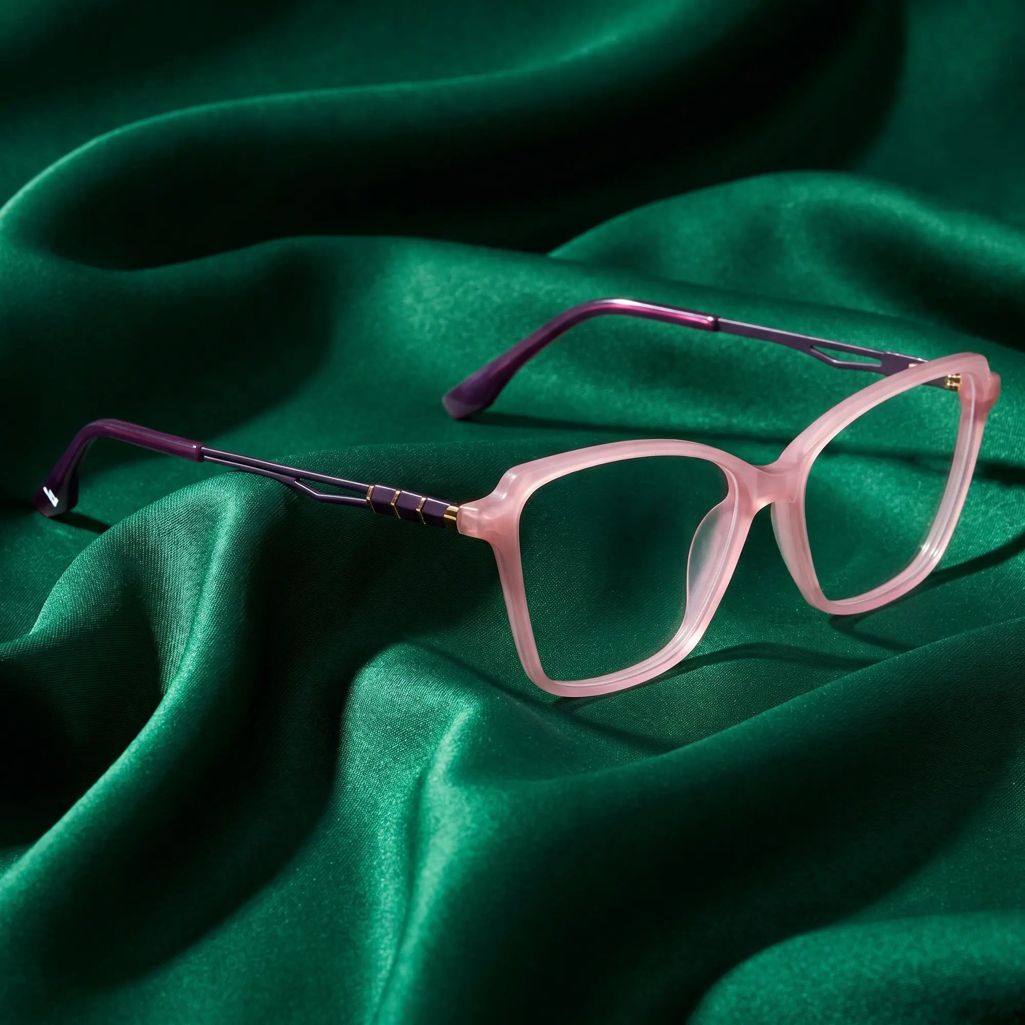 Fiore 1006 eyeglasses in pink – nested in flowing emerald silk