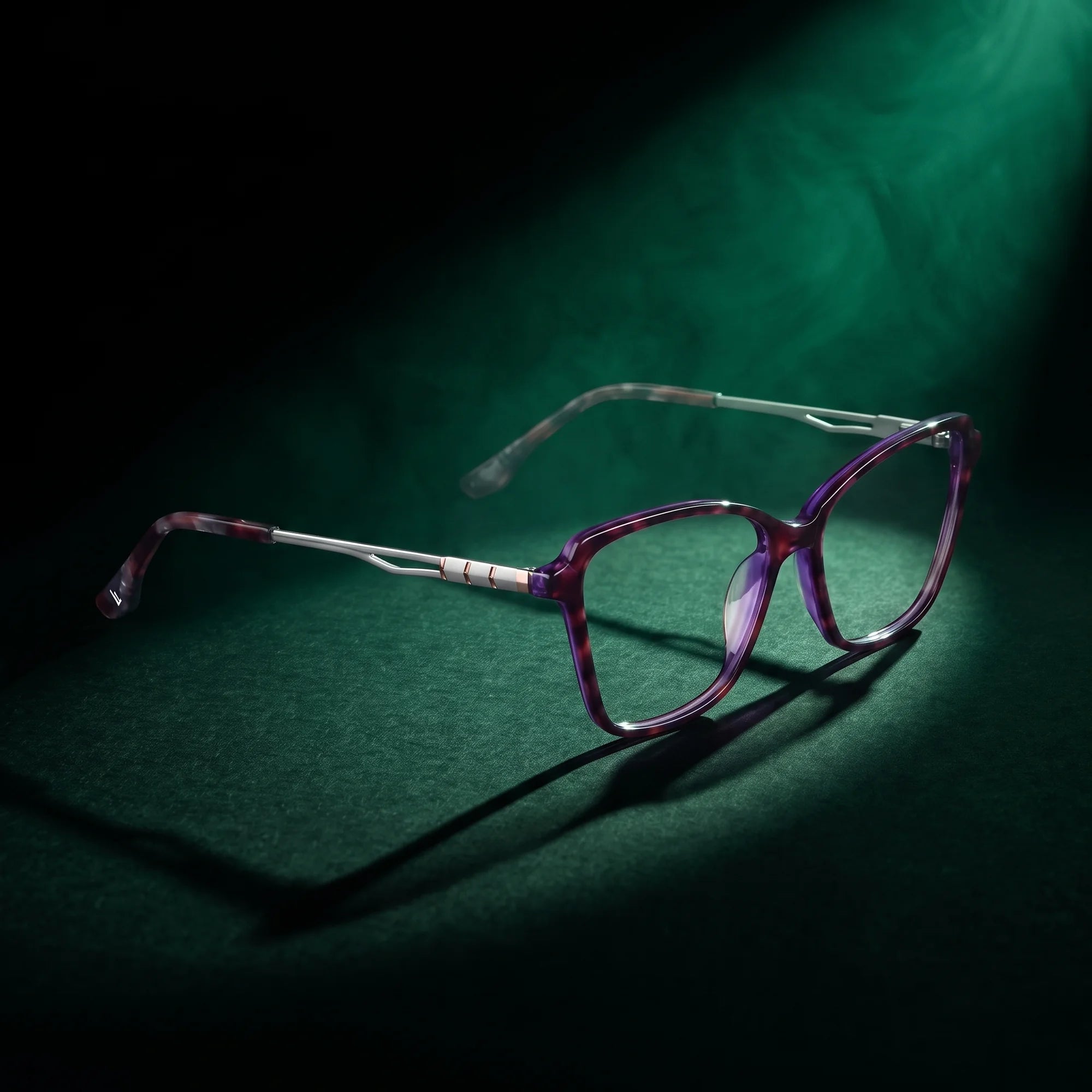 Fiore 1006 eyeglasses in purple – under a theatrical beam of light