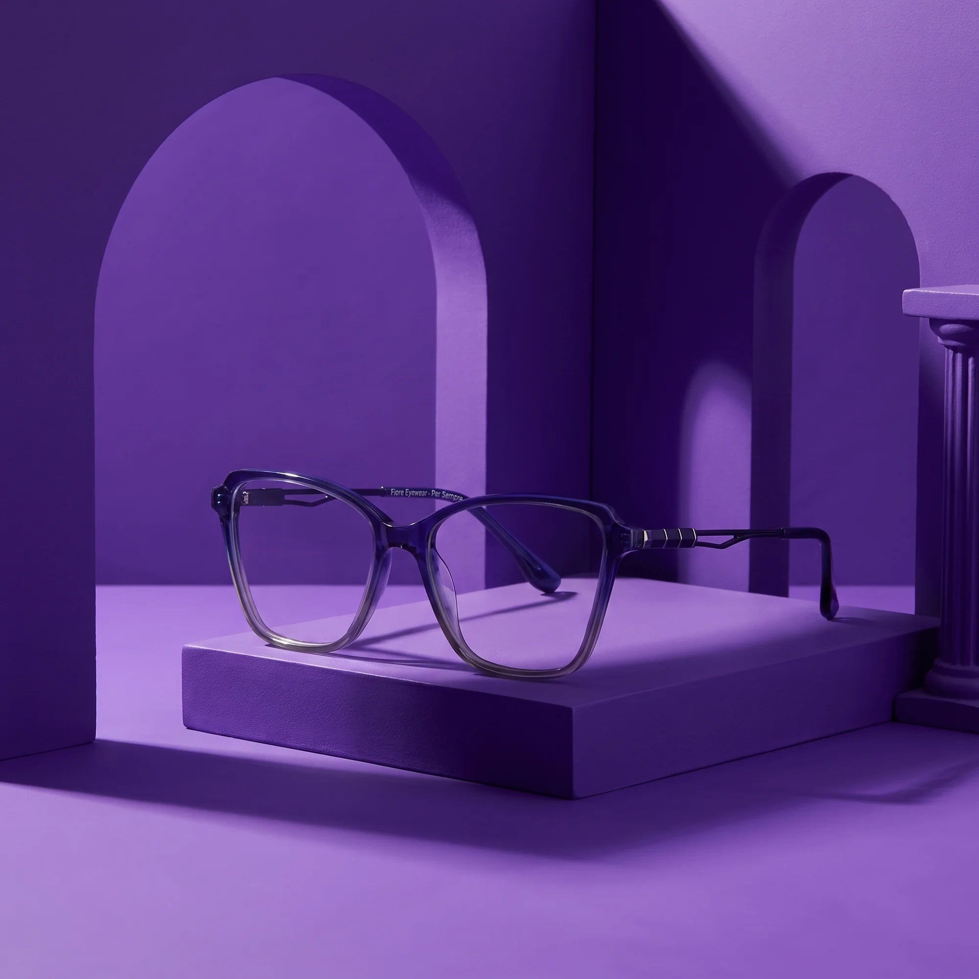 Fiore 1006 eyeglasses in blue – staged on a sculptural violet architecture set