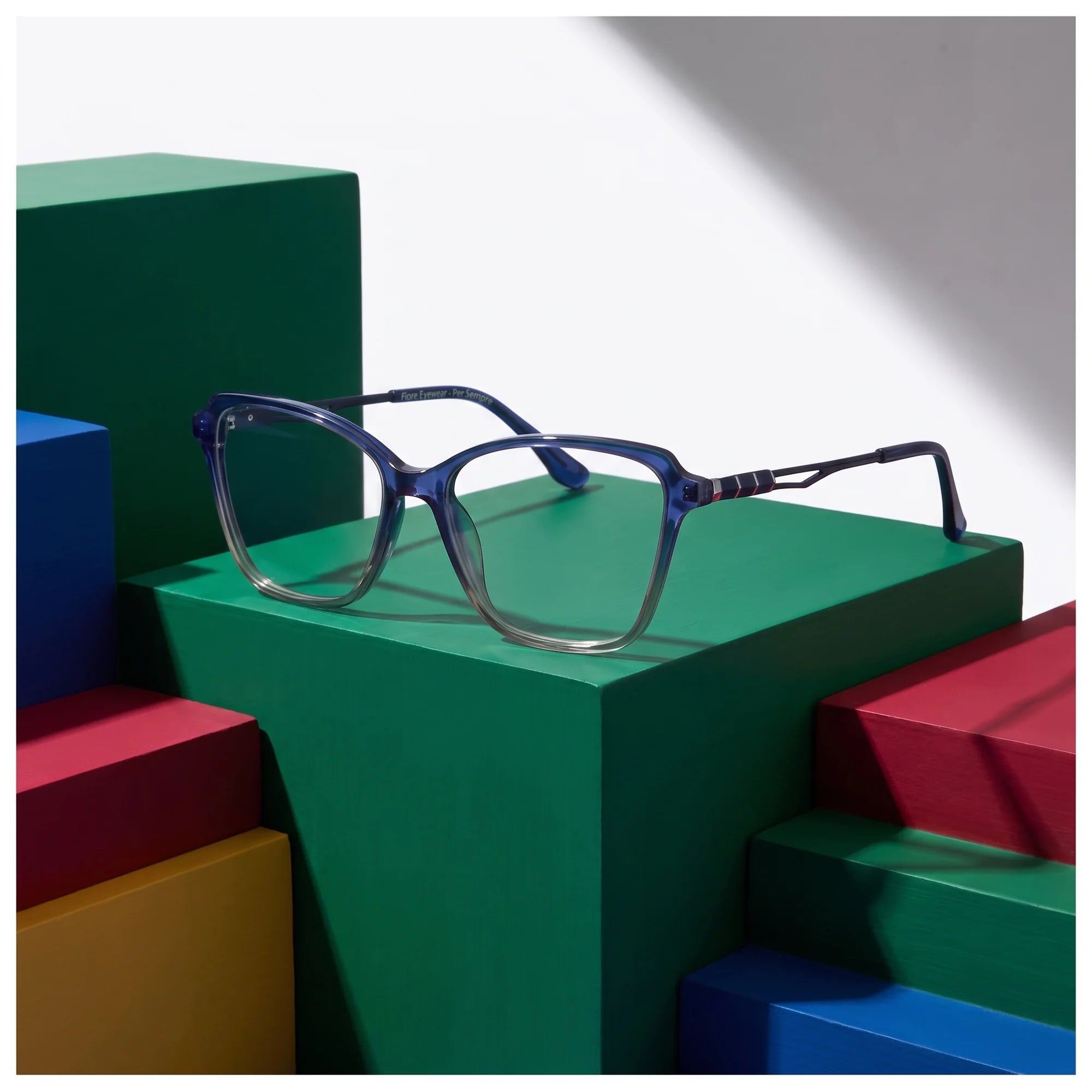 Fiore 1006 eyeglasses in blue – on bold primary color-block steps