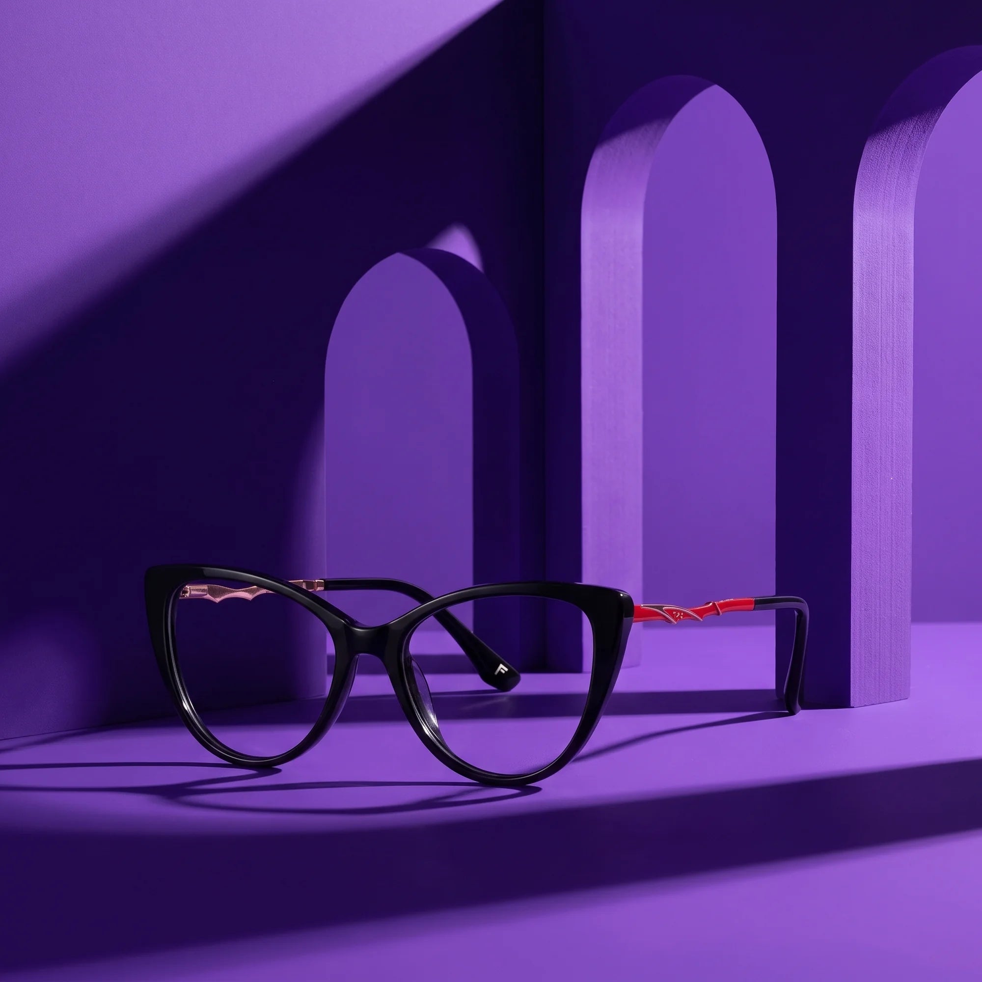 Fiore 1010 eyeglasses in black – staged on a sculptural violet architecture set