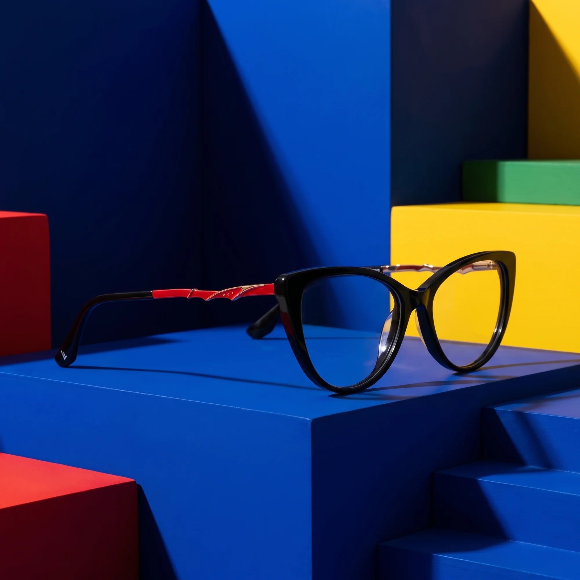 Fiore 1010 eyeglasses in black – on bold primary color-block steps