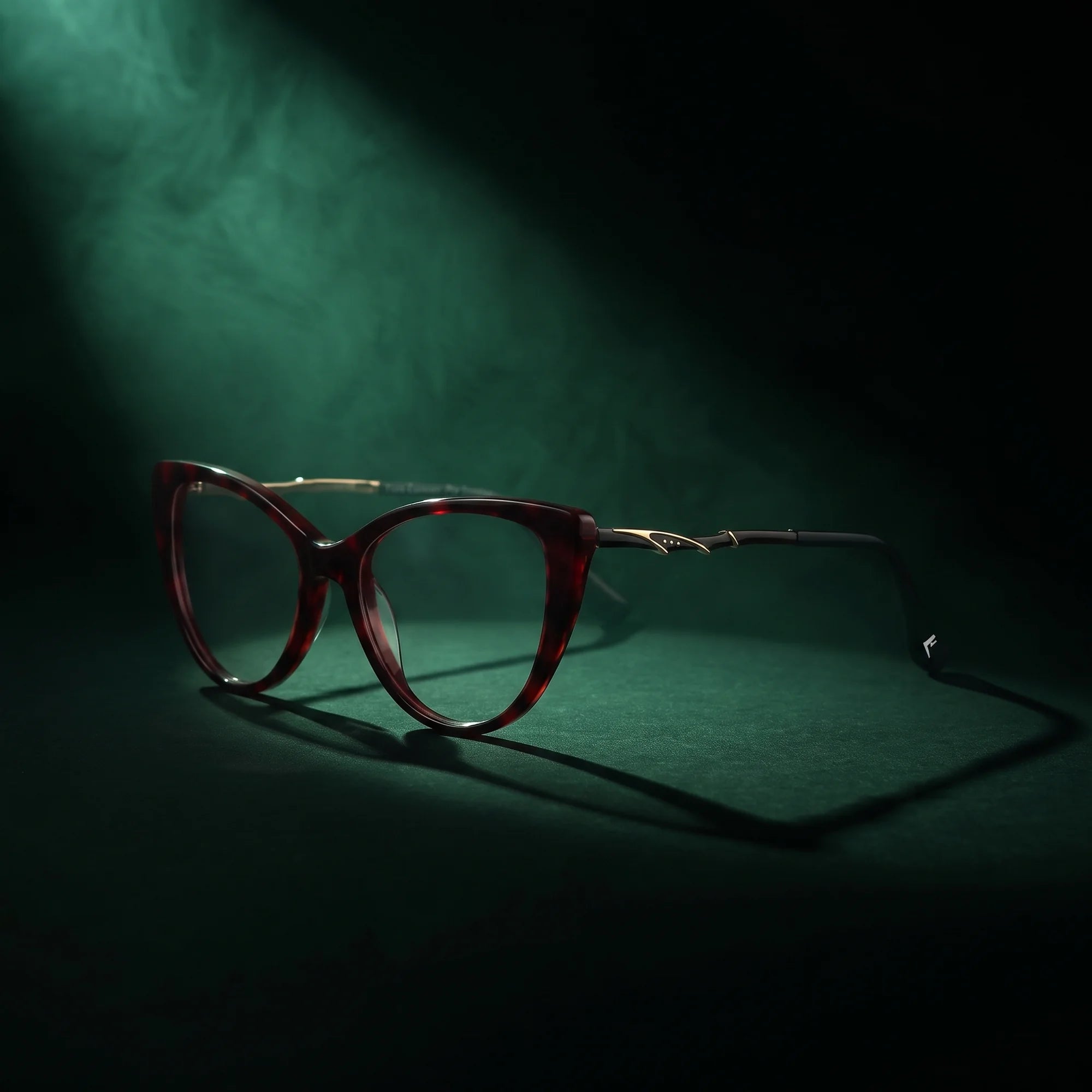 Fiore 1010 eyeglasses in red – under a theatrical beam of light