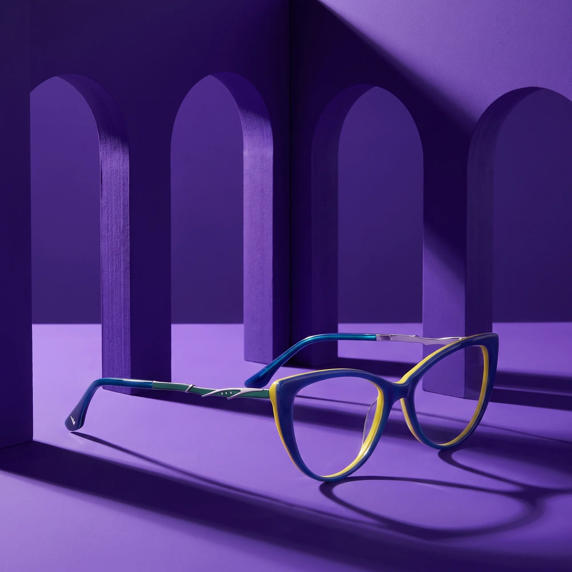 Fiore 1010 eyeglasses in blue green – still life among monochrome violet arches