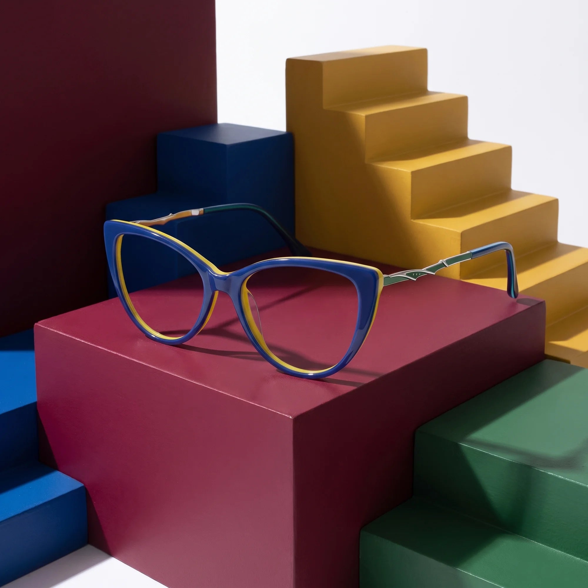Fiore 1010 eyeglasses in blue green – on bold primary color-block steps