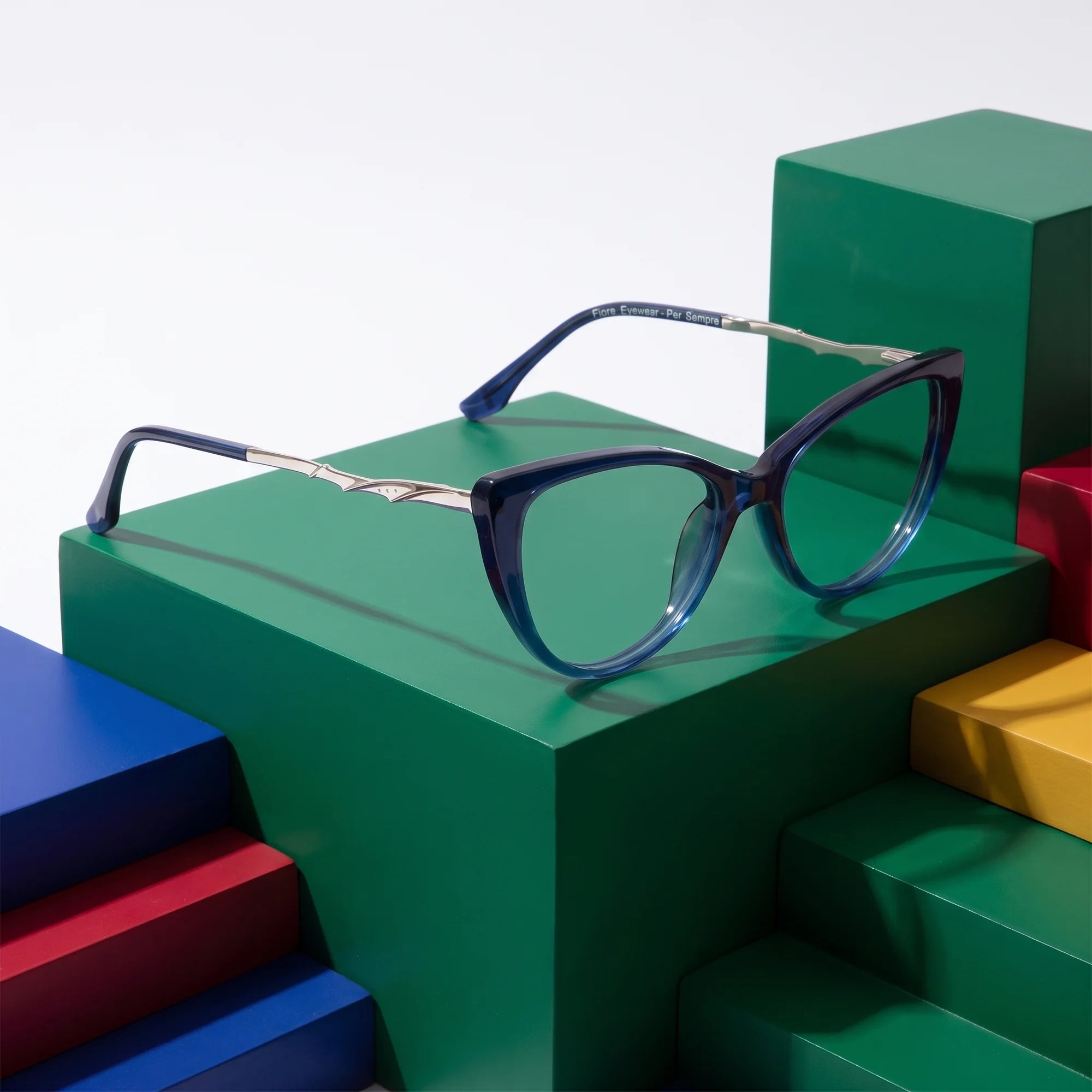Fiore 1010 eyeglasses in blue – on bold primary color-block steps