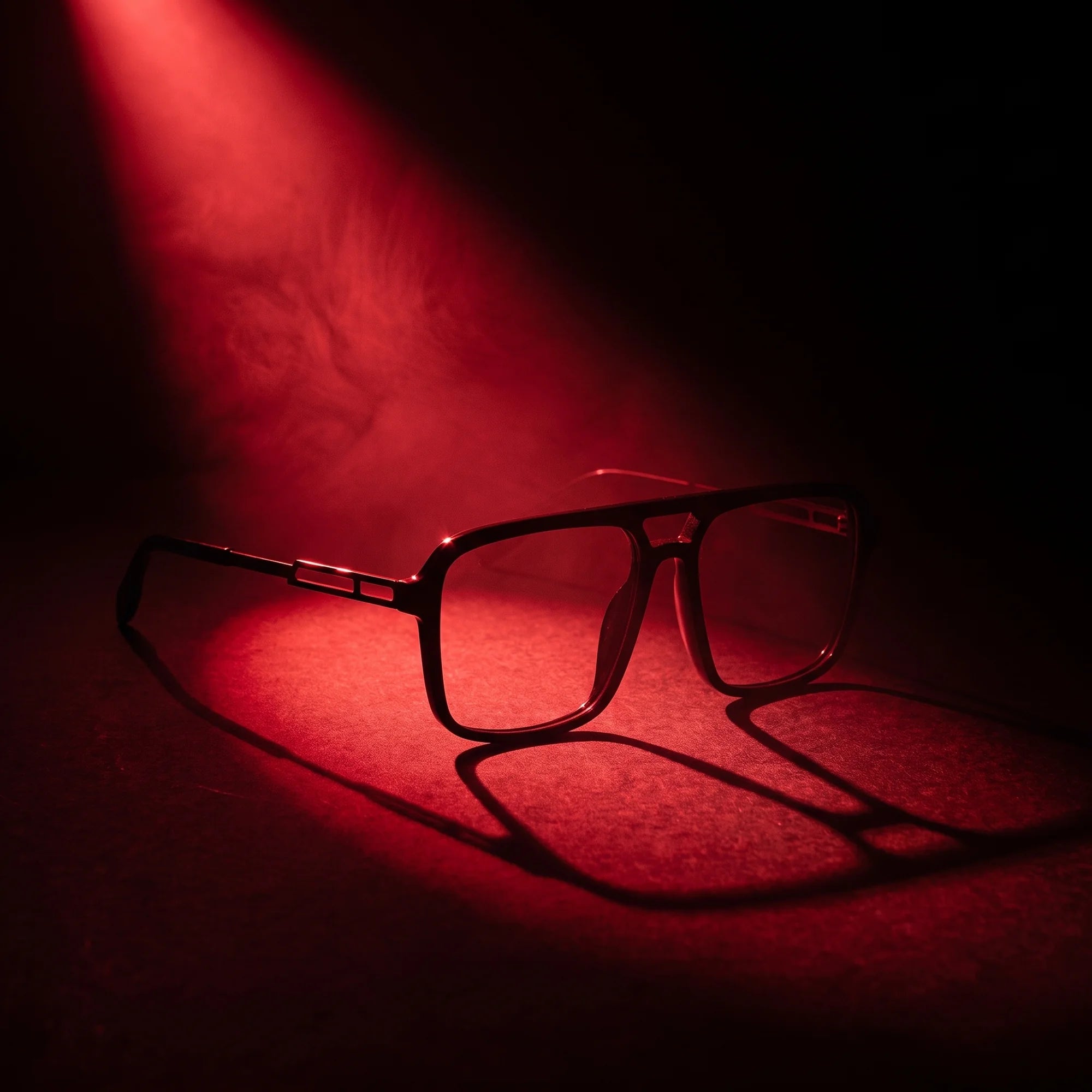 Fiore 1014 eyeglasses in black – under a theatrical beam of light