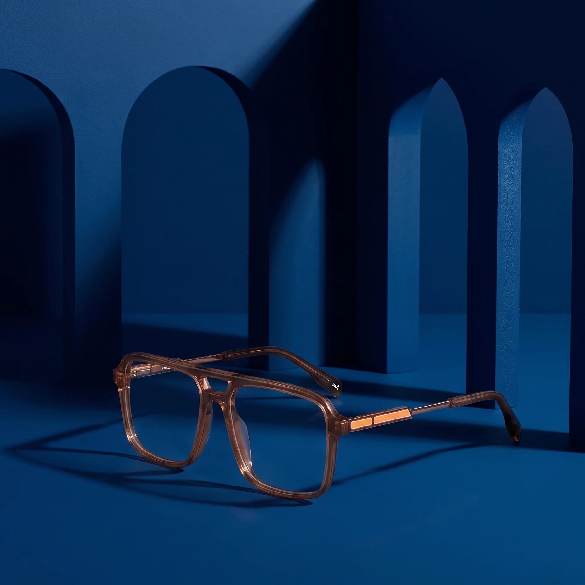 Fiore 1014 eyeglasses in brown – still life among monochrome midnight blue arches