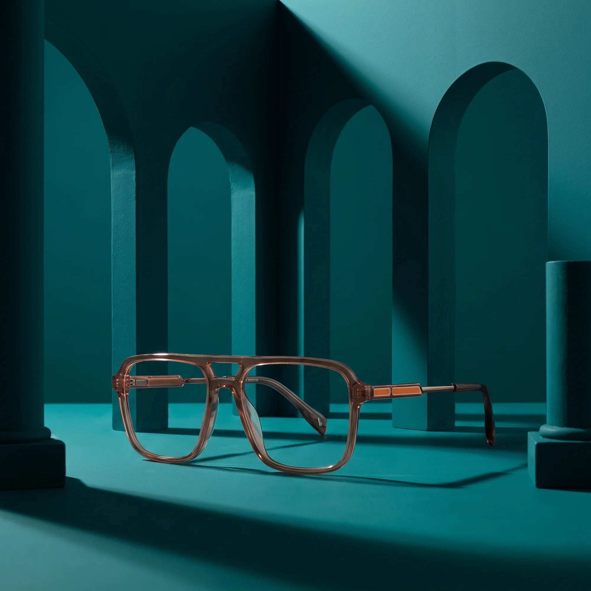 Fiore 1014 eyeglasses in brown – staged on a sculptural teal architecture set