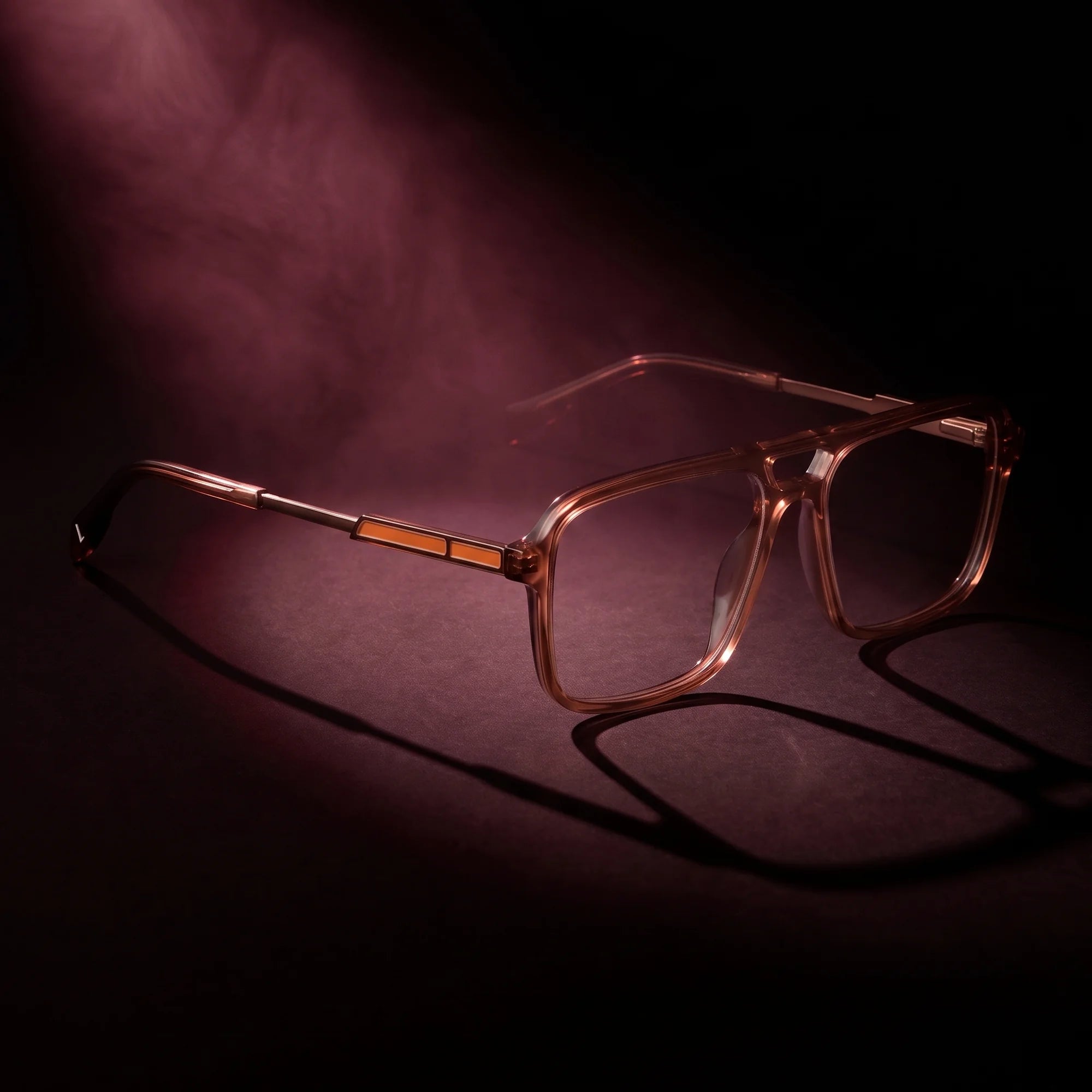 Fiore 1014 eyeglasses in brown – under a theatrical beam of light