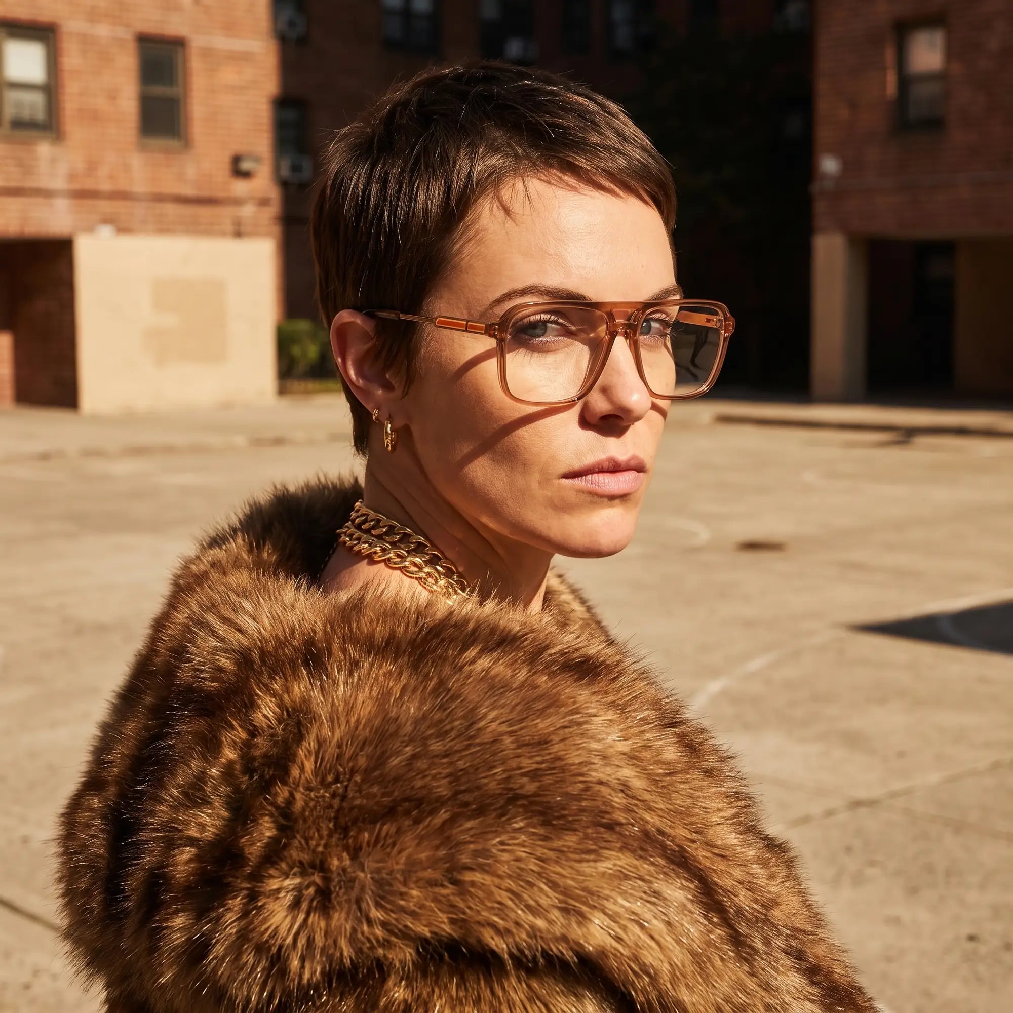 Fiore 1014 eyeglasses in brown, worn by a model – campaign portrait, street portrait rooted in city heritage