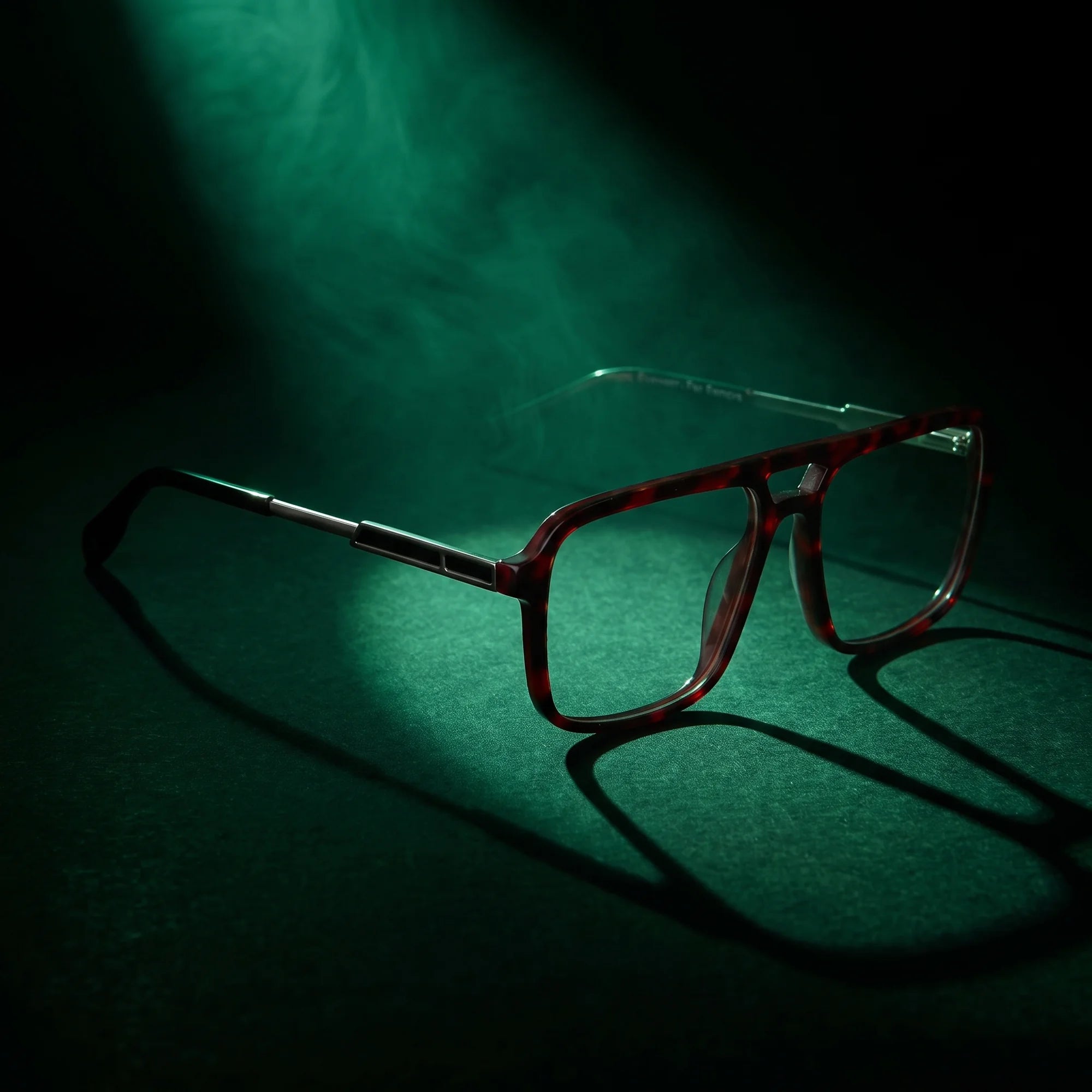 Fiore 1014 eyeglasses in tortoiseshell – under a theatrical beam of light