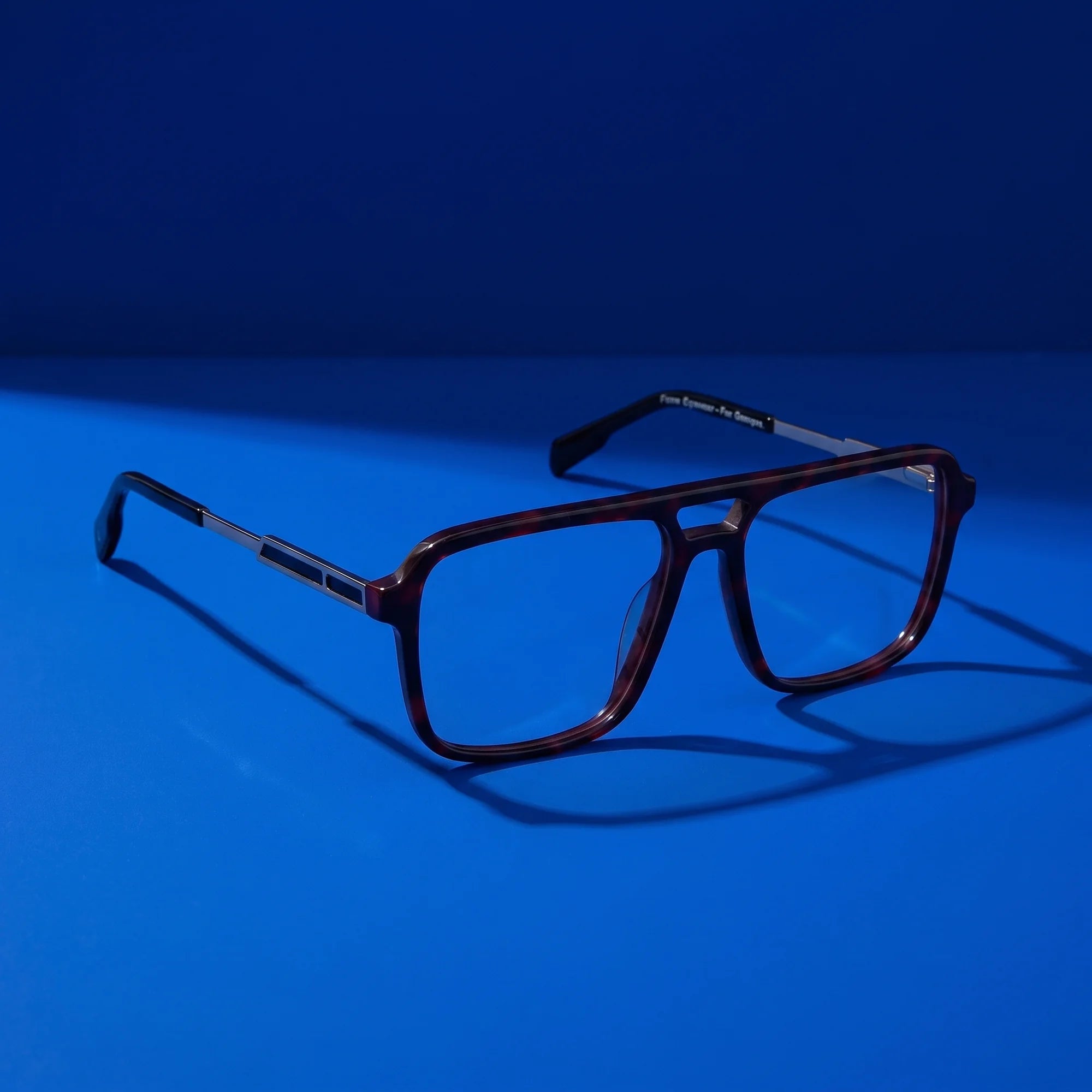 Fiore 1014 eyeglasses in tortoiseshell – still life on a seamless cobalt studio backdrop