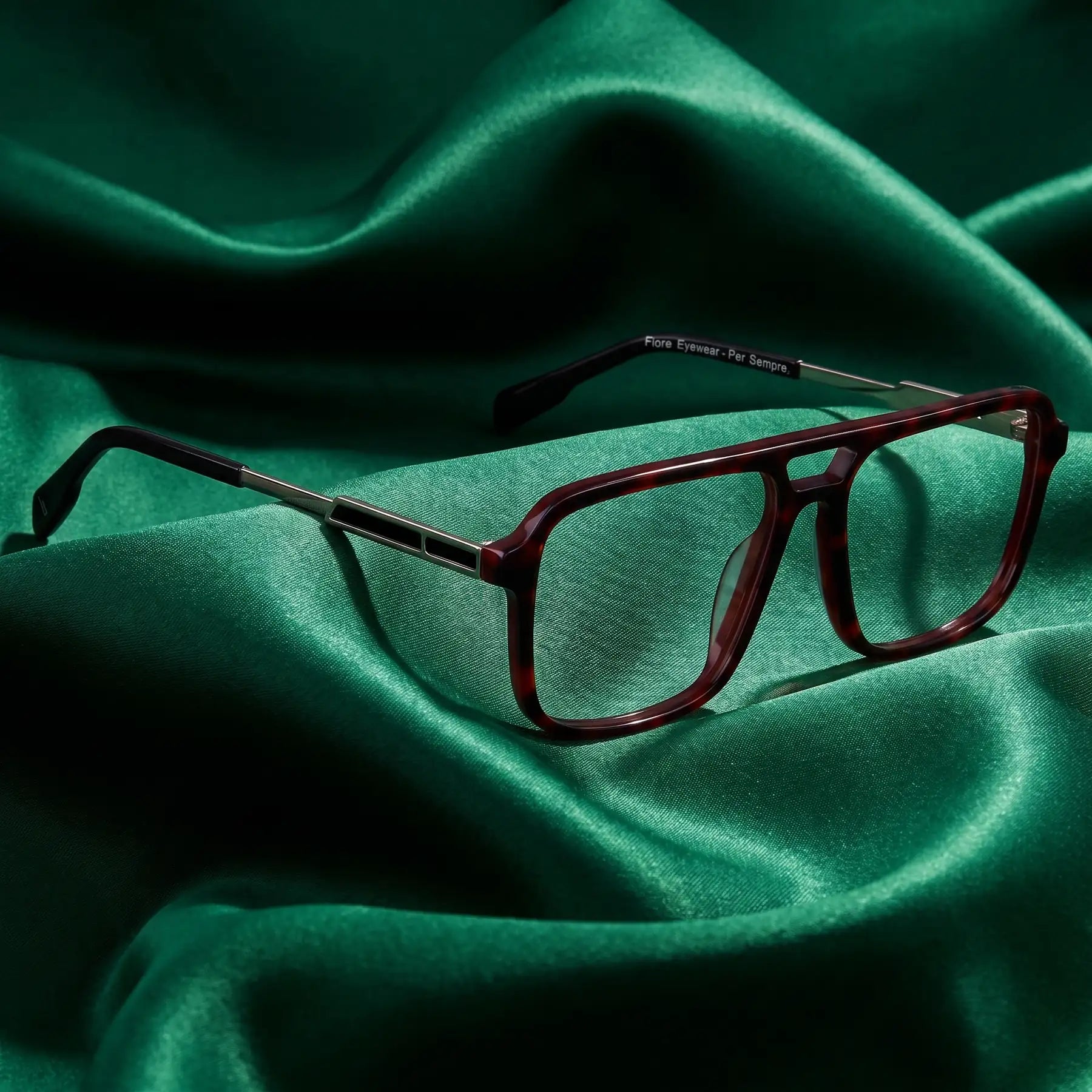 Fiore 1014 eyeglasses in tortoiseshell – nested in flowing emerald silk