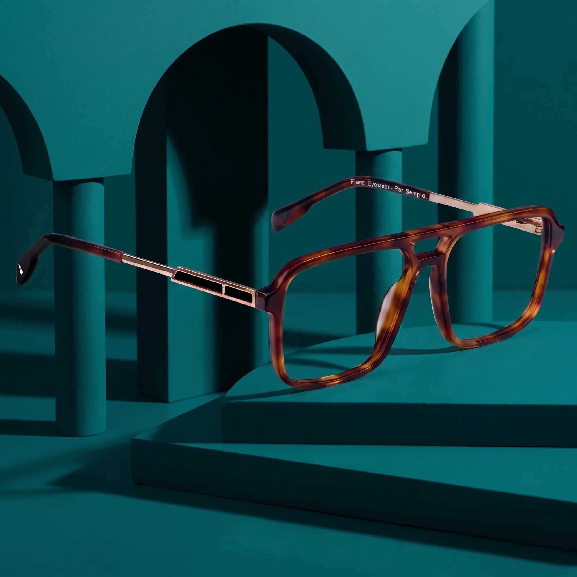 Fiore 1014 eyeglasses in brown tortoiseshell – still life among monochrome teal arches