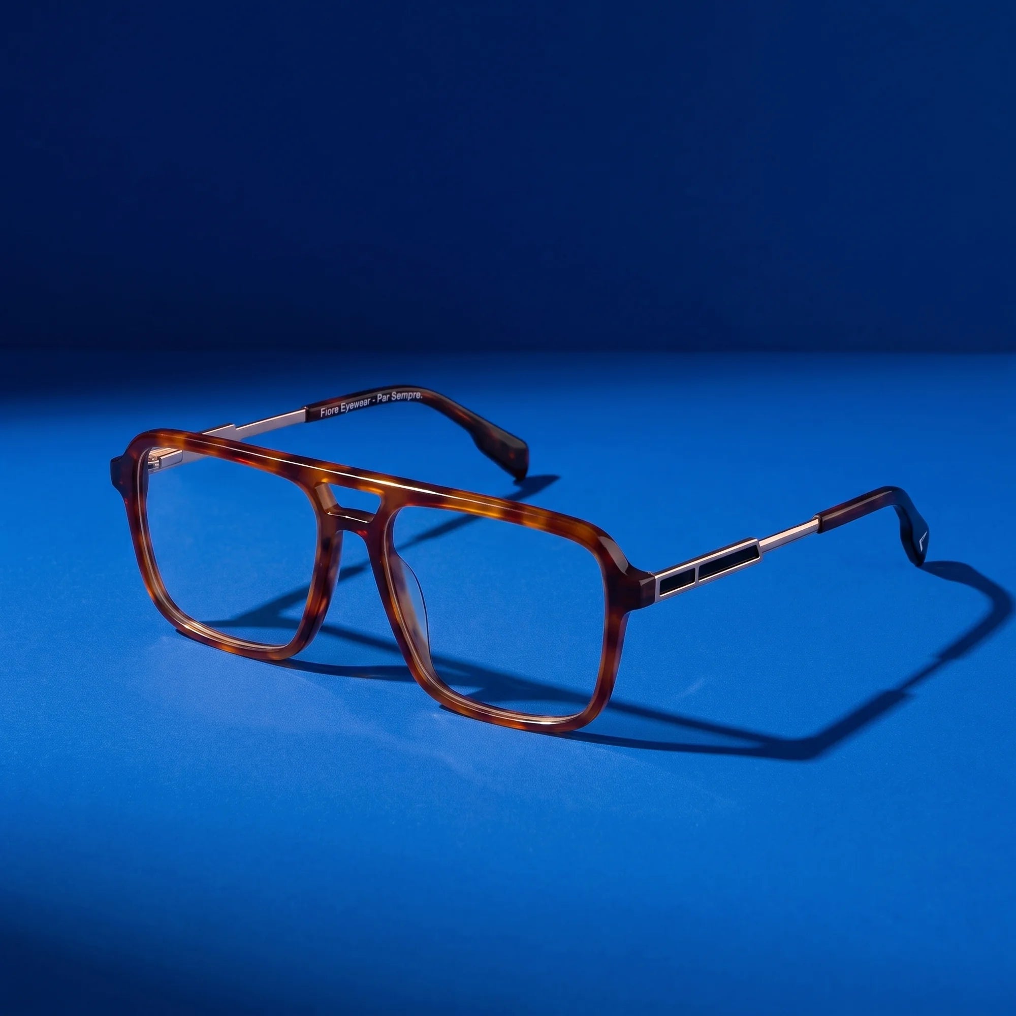 Fiore 1014 eyeglasses in brown tortoiseshell – still life on a seamless cobalt studio backdrop