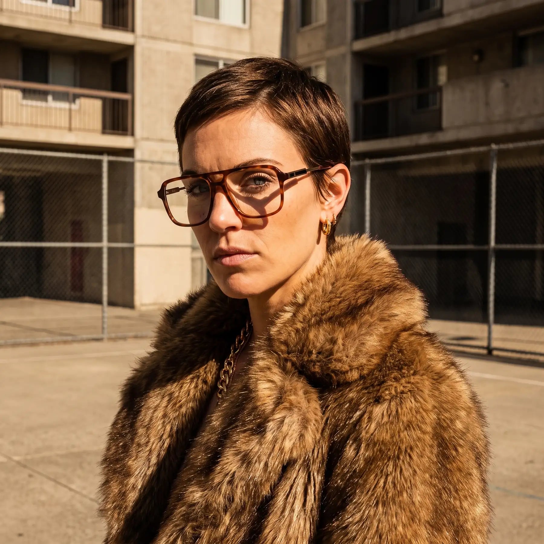 Fiore 1014 eyeglasses in brown tortoiseshell, worn by a model – campaign portrait, street portrait rooted in city heritage
