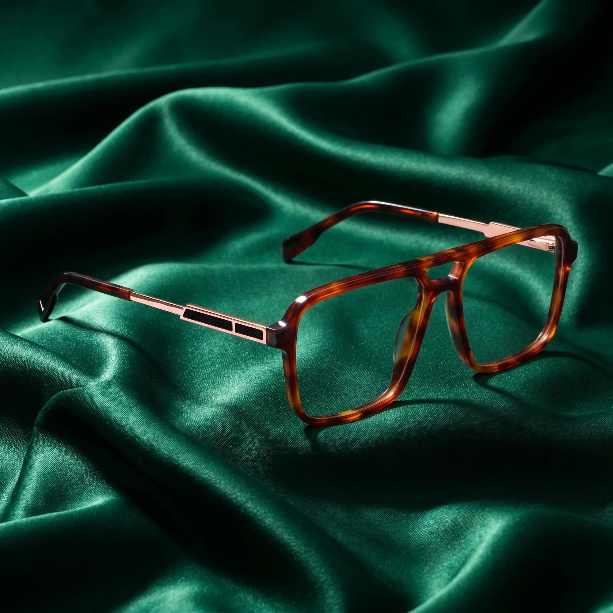Fiore 1014 eyeglasses in brown tortoiseshell – nested in flowing emerald silk