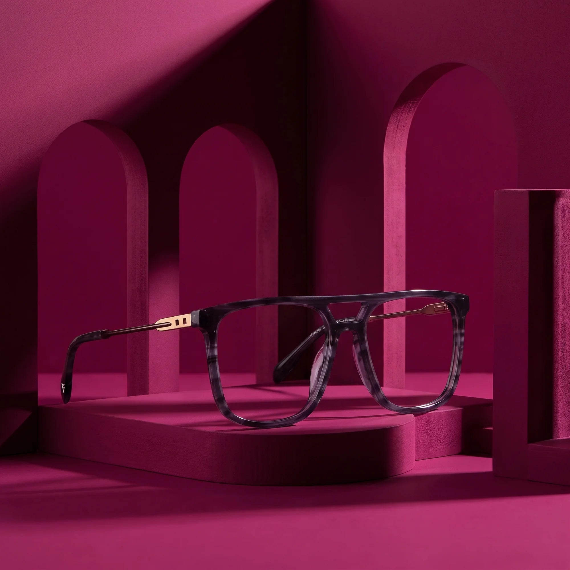 Fiore 10177 eyeglasses in grey – staged on a sculptural magenta architecture set