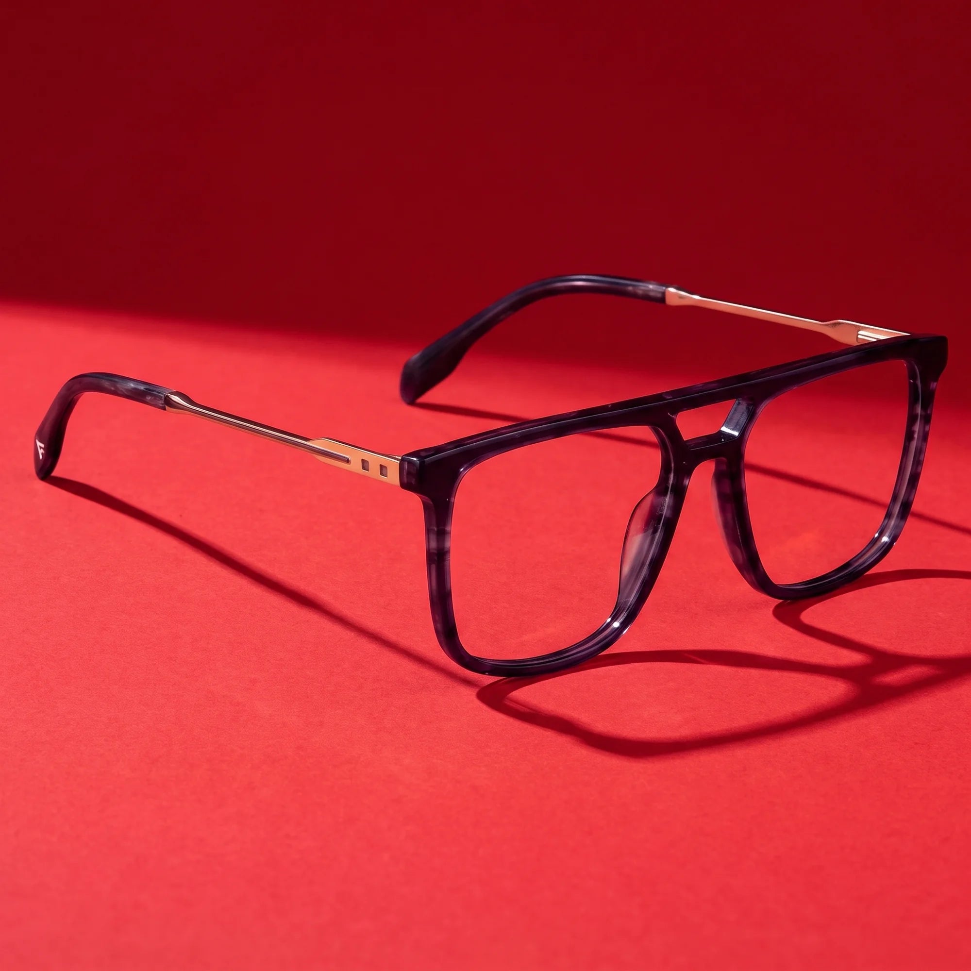 Fiore 10177 eyeglasses in grey – editorial still life on a saturated vivid red set