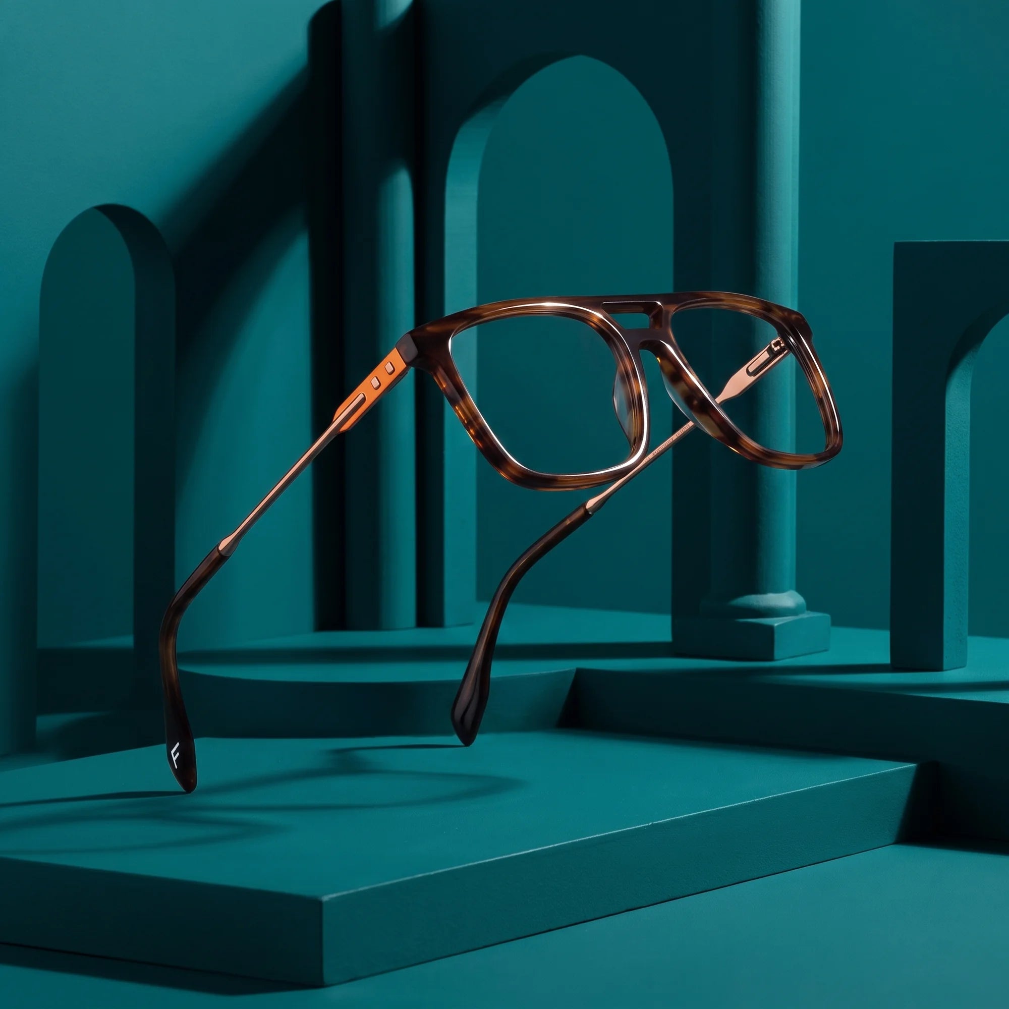 Fiore 10177 eyeglasses in tortoiseshell – still life among monochrome teal arches