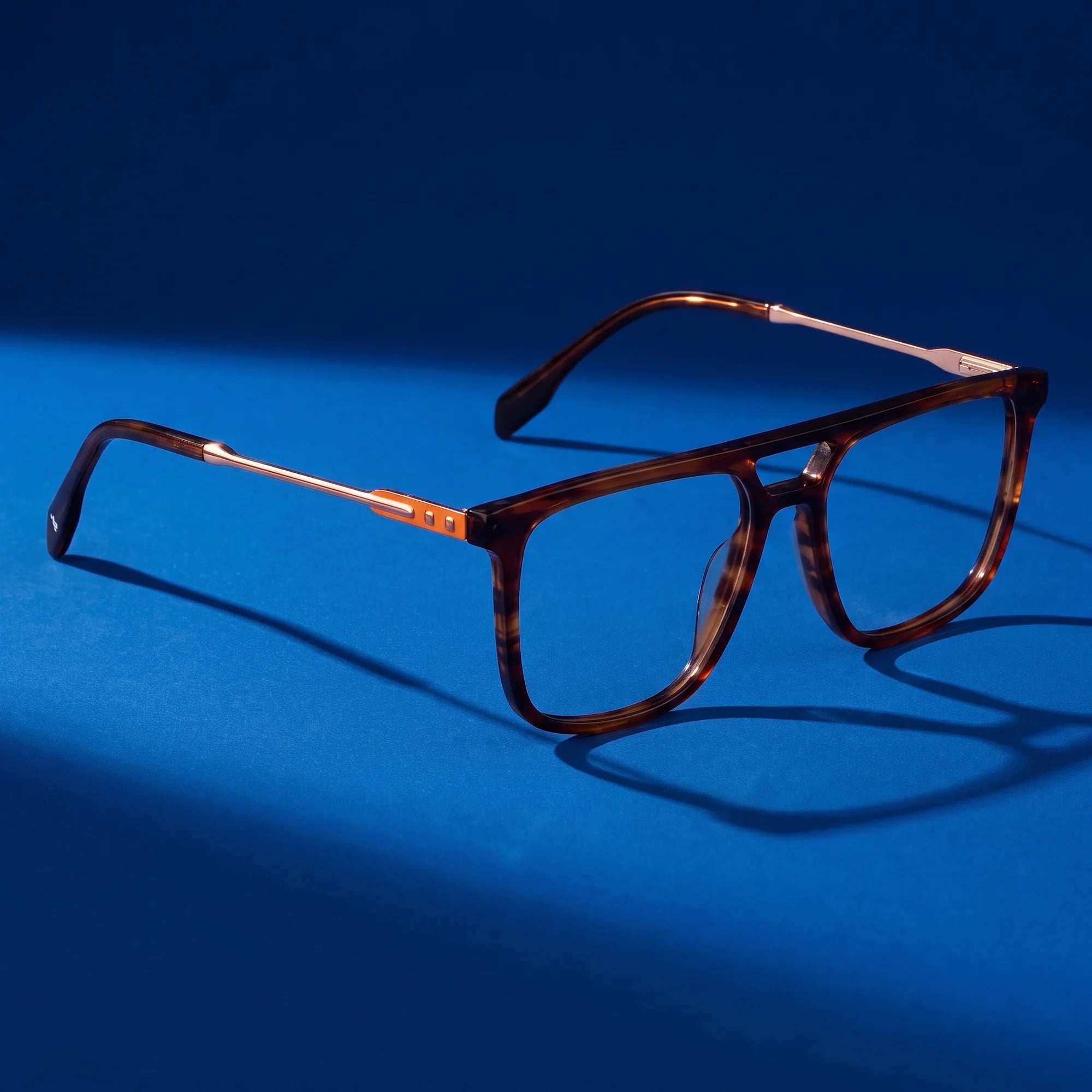 Fiore 10177 eyeglasses in tortoiseshell – still life on a seamless cobalt studio backdrop
