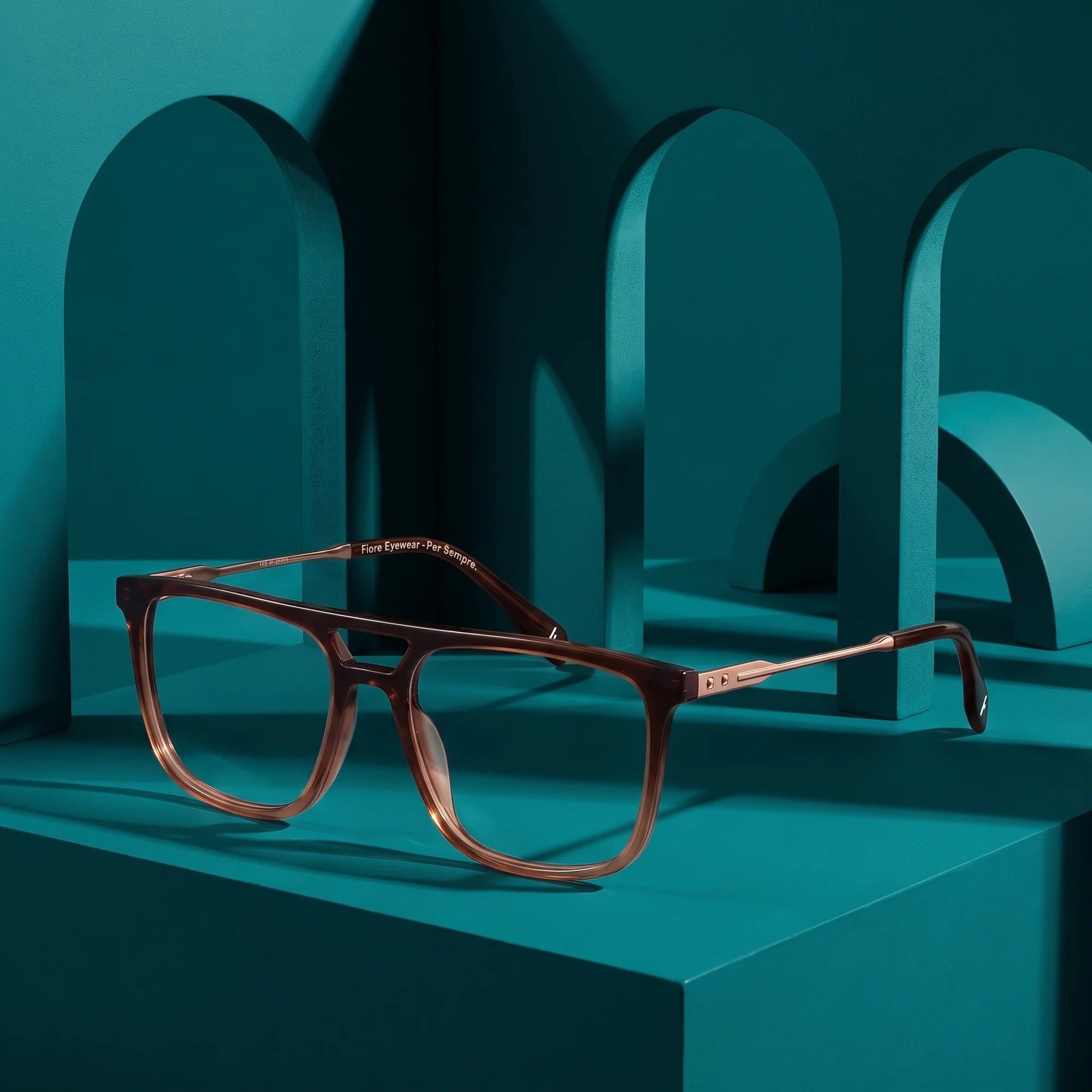 Fiore 10177 eyeglasses in brown – still life among monochrome teal arches