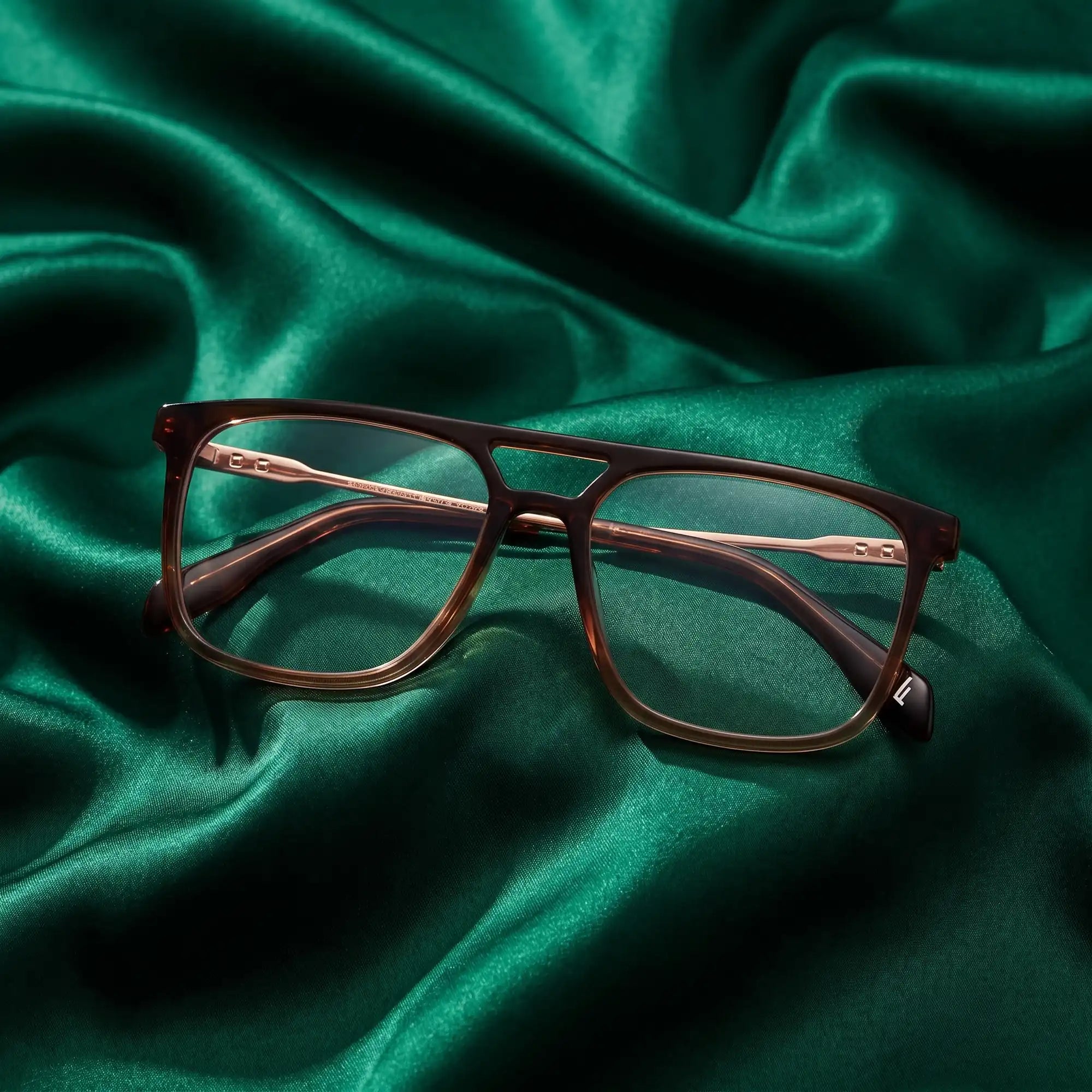 Fiore 10177 eyeglasses in brown – nested in flowing emerald silk
