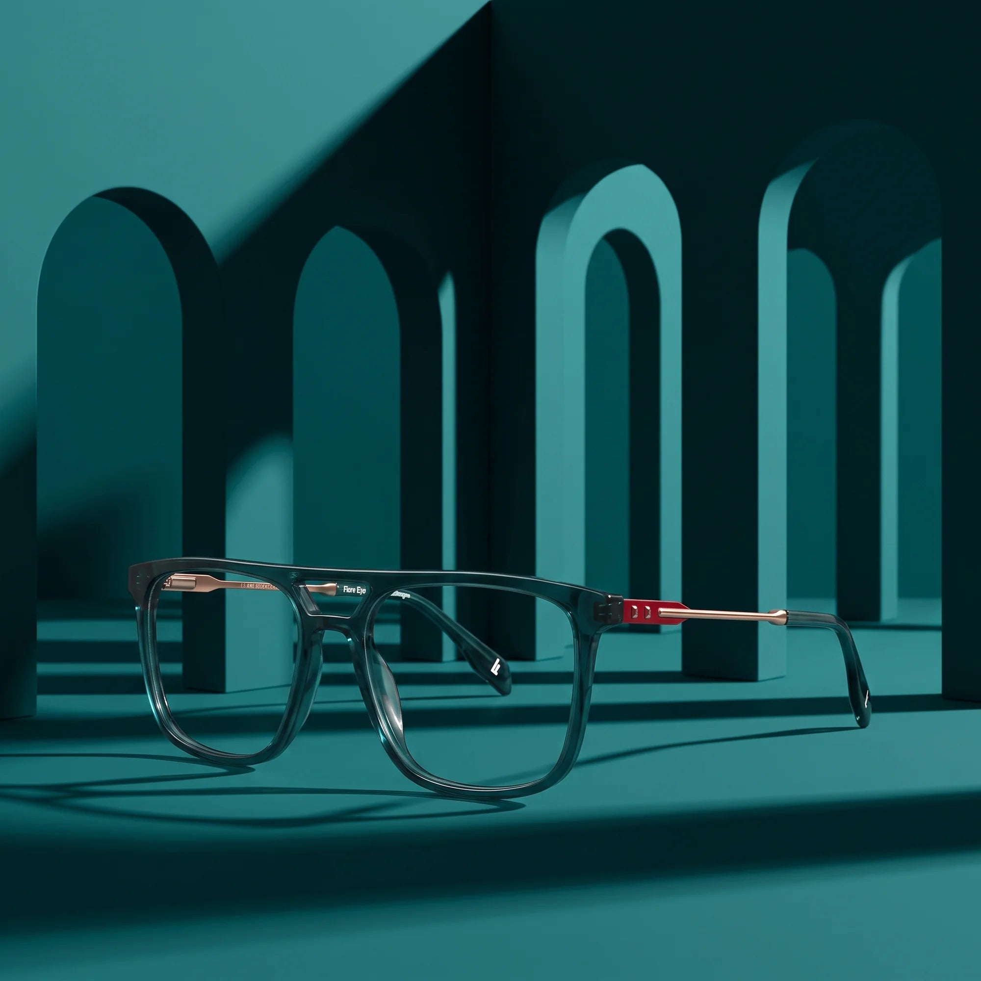 Fiore 10177 eyeglasses in green – displayed on a teal podium among arches