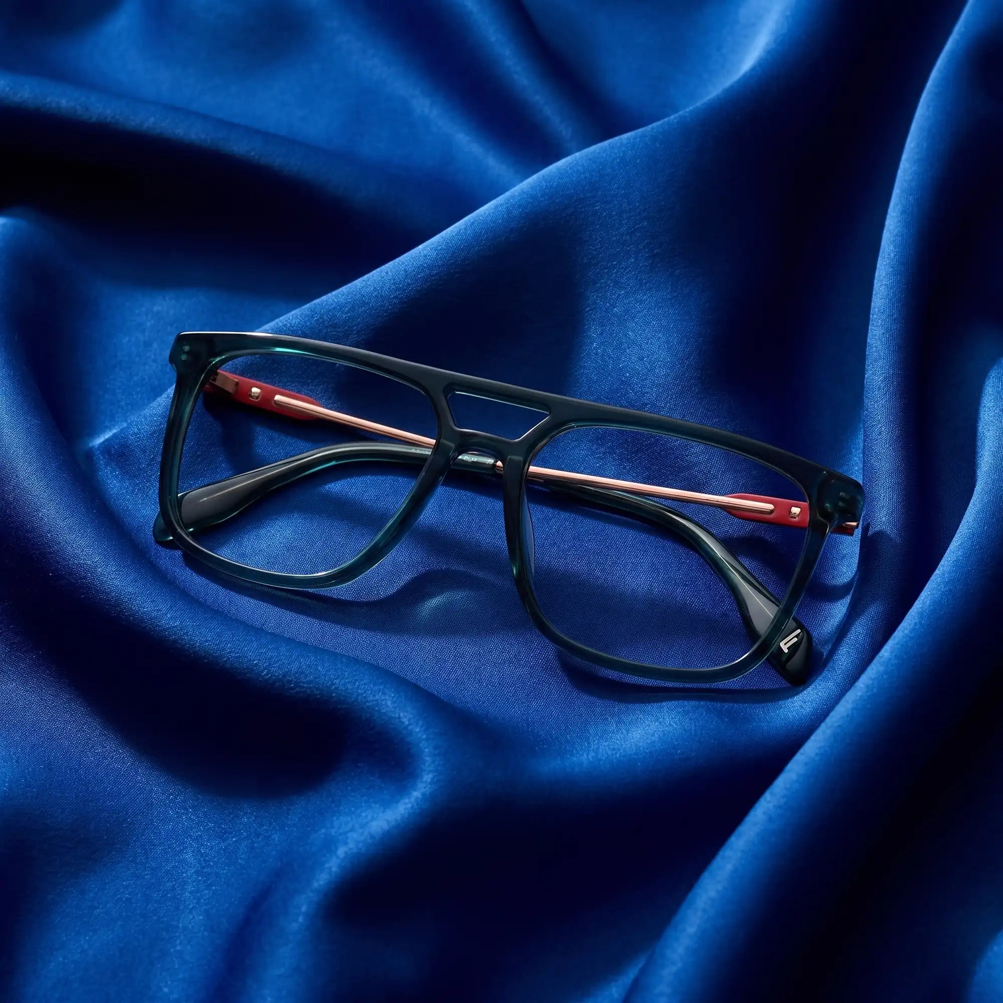 Fiore 10177 eyeglasses in green – nested in flowing cobalt silk
