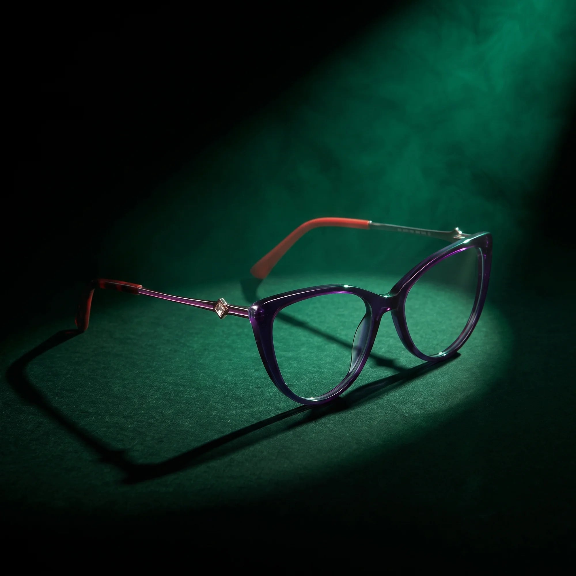 Fiore 1031 eyeglasses in purple green – under a theatrical beam of light