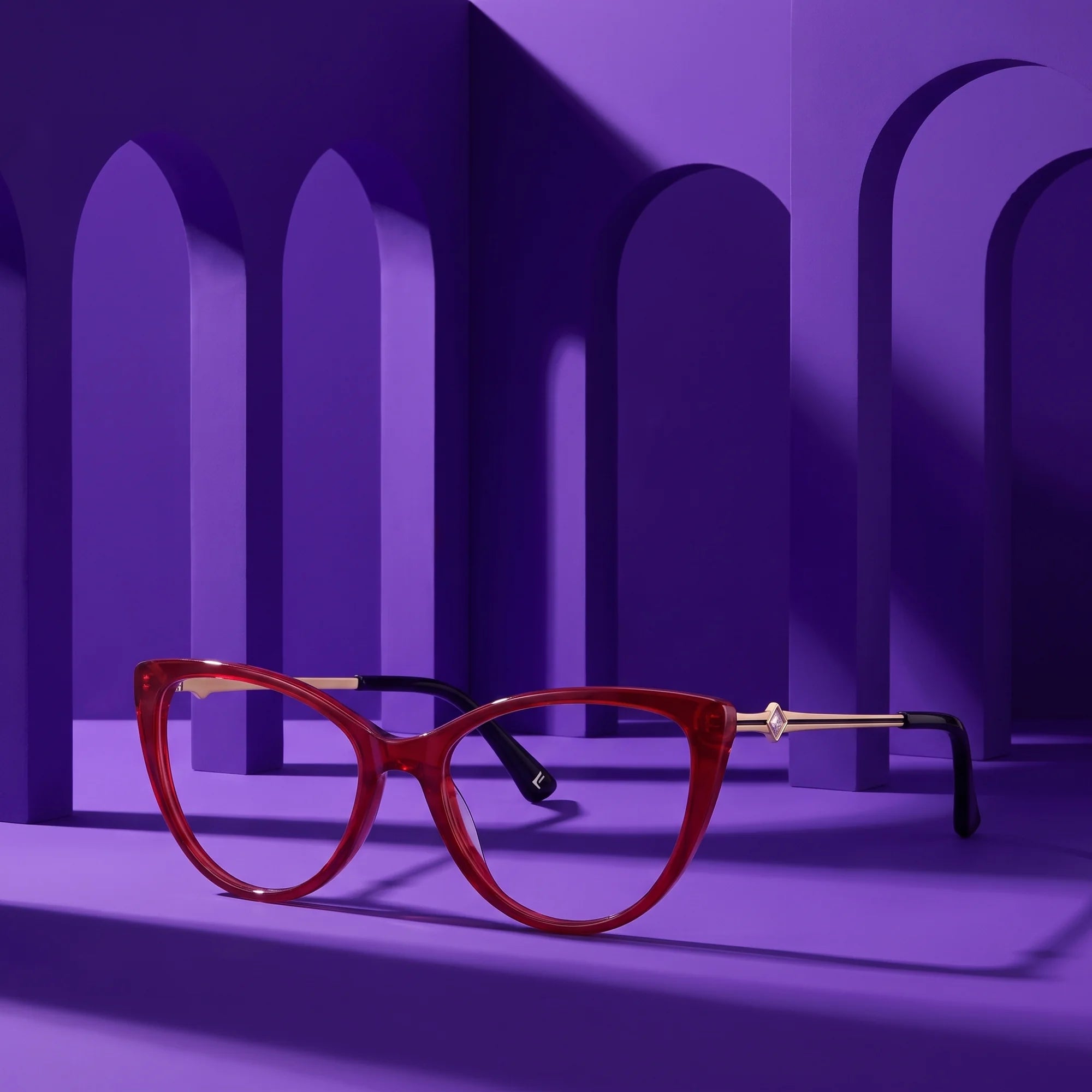 Fiore 1031 eyeglasses in red – staged on a sculptural violet architecture set