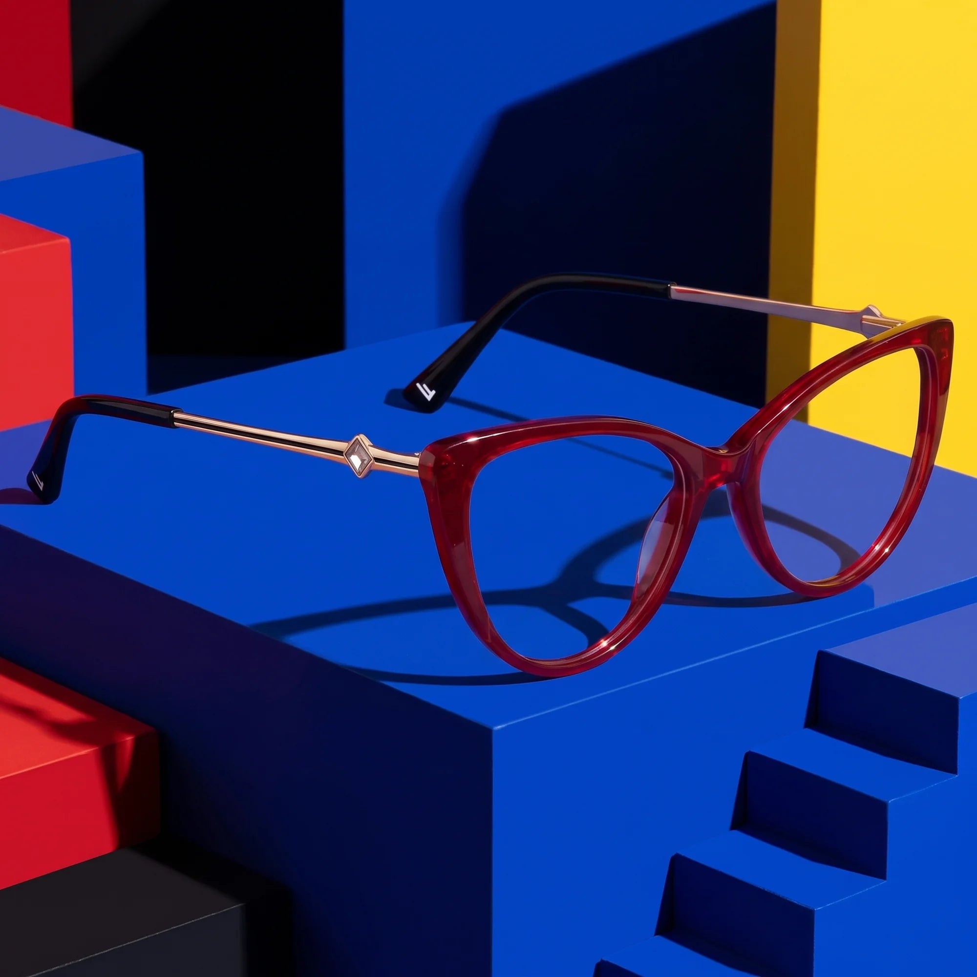 Fiore 1031 eyeglasses in red – on bold primary color-block steps