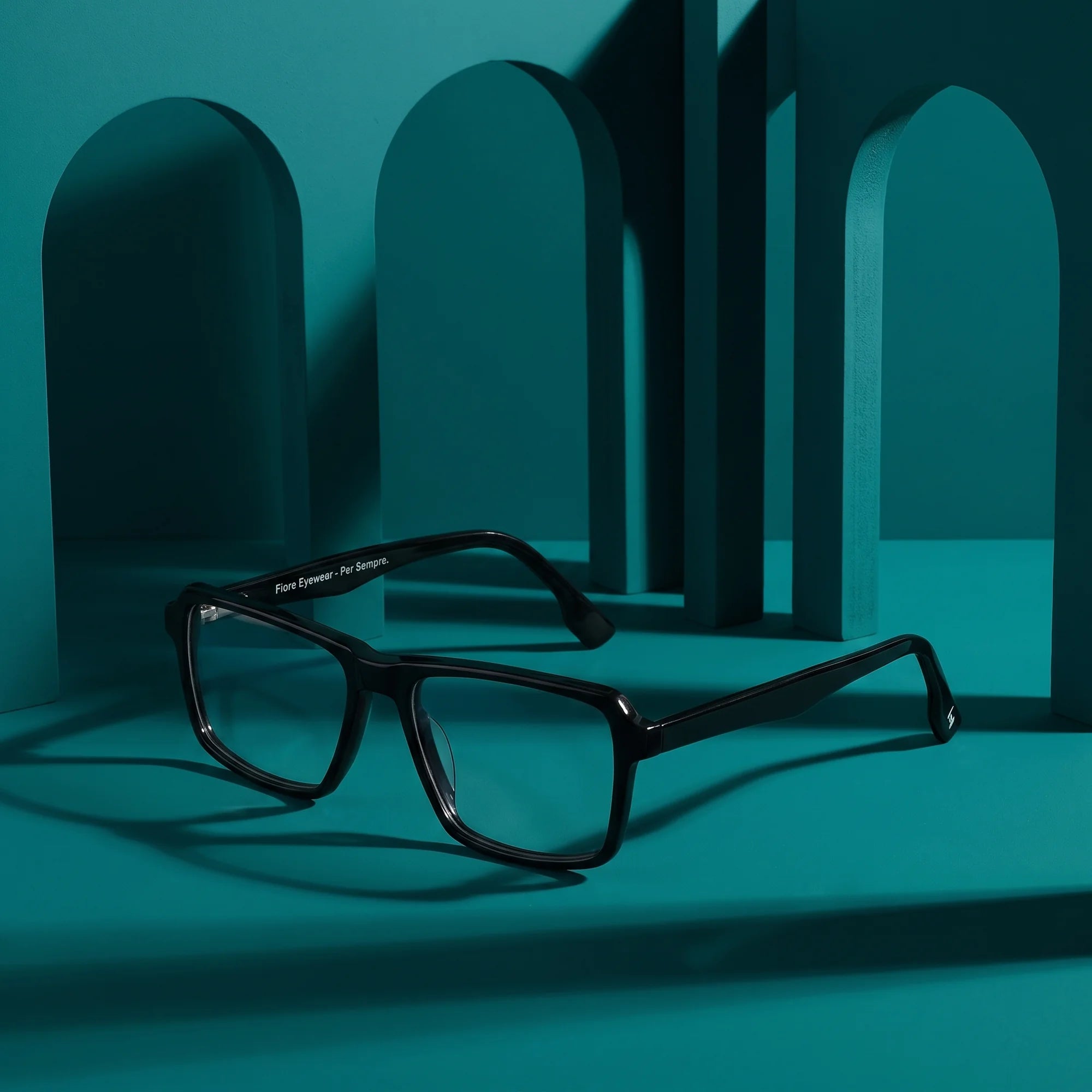 Fiore 1038 eyeglasses in black – still life among monochrome teal arches