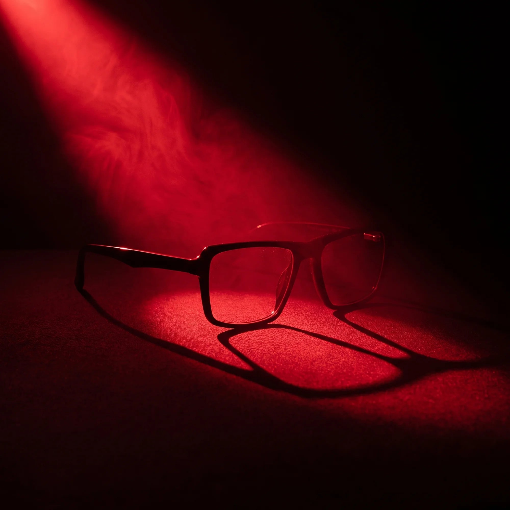 Fiore 1038 eyeglasses in black – under a theatrical beam of light