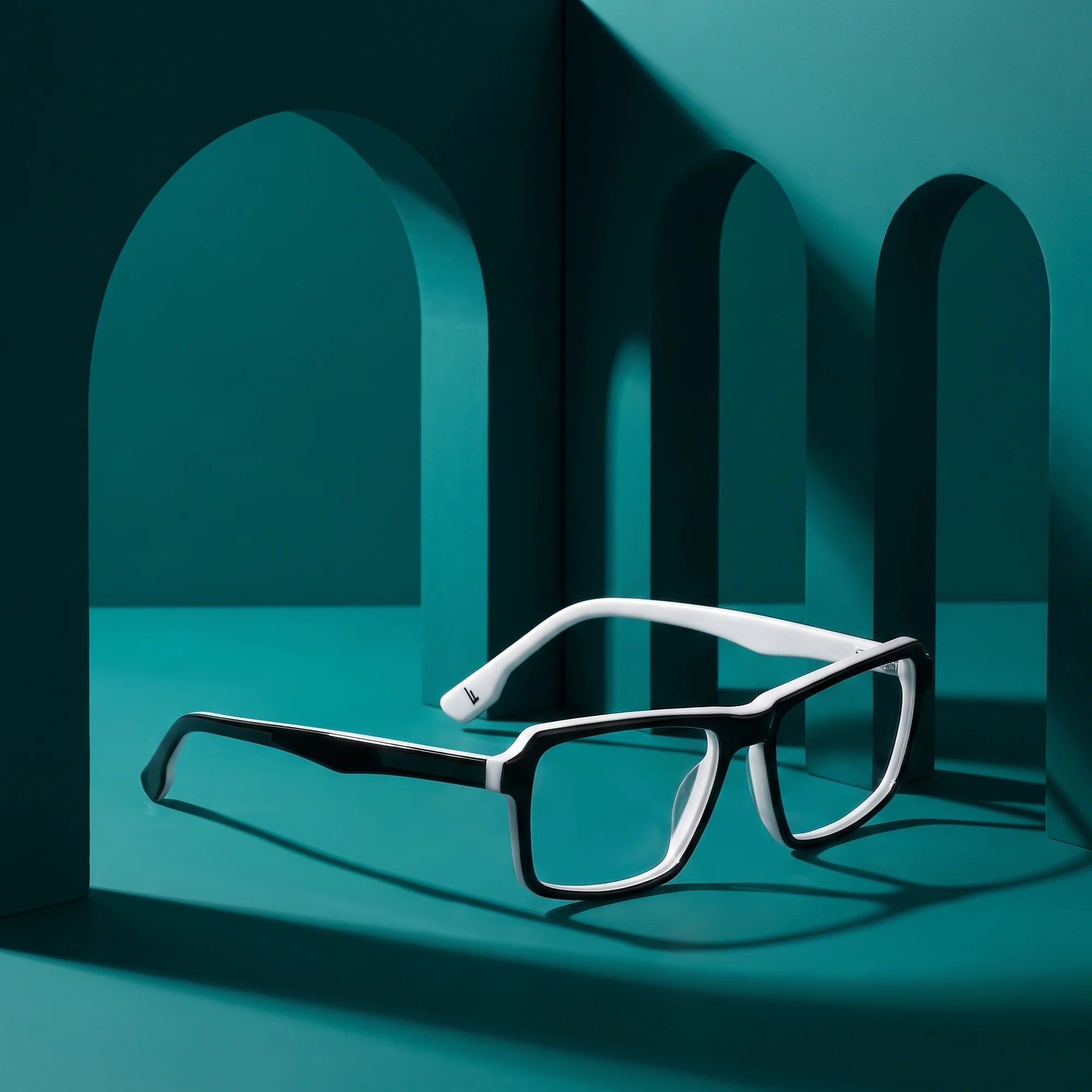 Fiore 1038 eyeglasses in black white – still life among monochrome teal arches