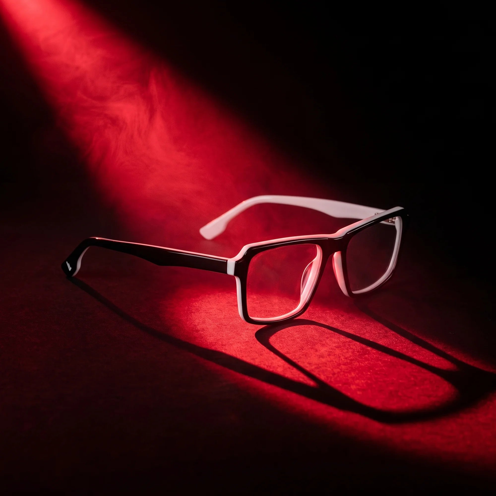 Fiore 1038 eyeglasses in black white – under a theatrical beam of light