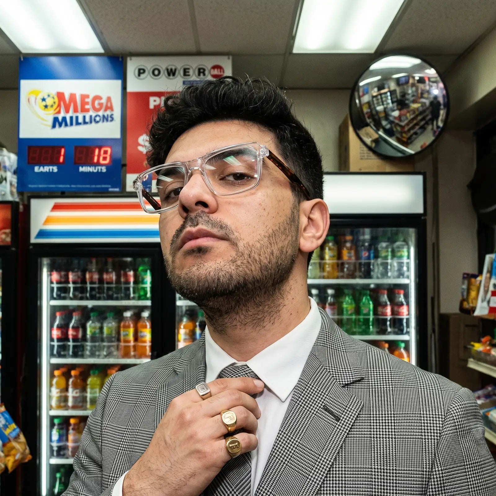 Fiore 1038 eyeglasses in transparent, worn by a model – campaign portrait, city heritage portrait on a mural wall