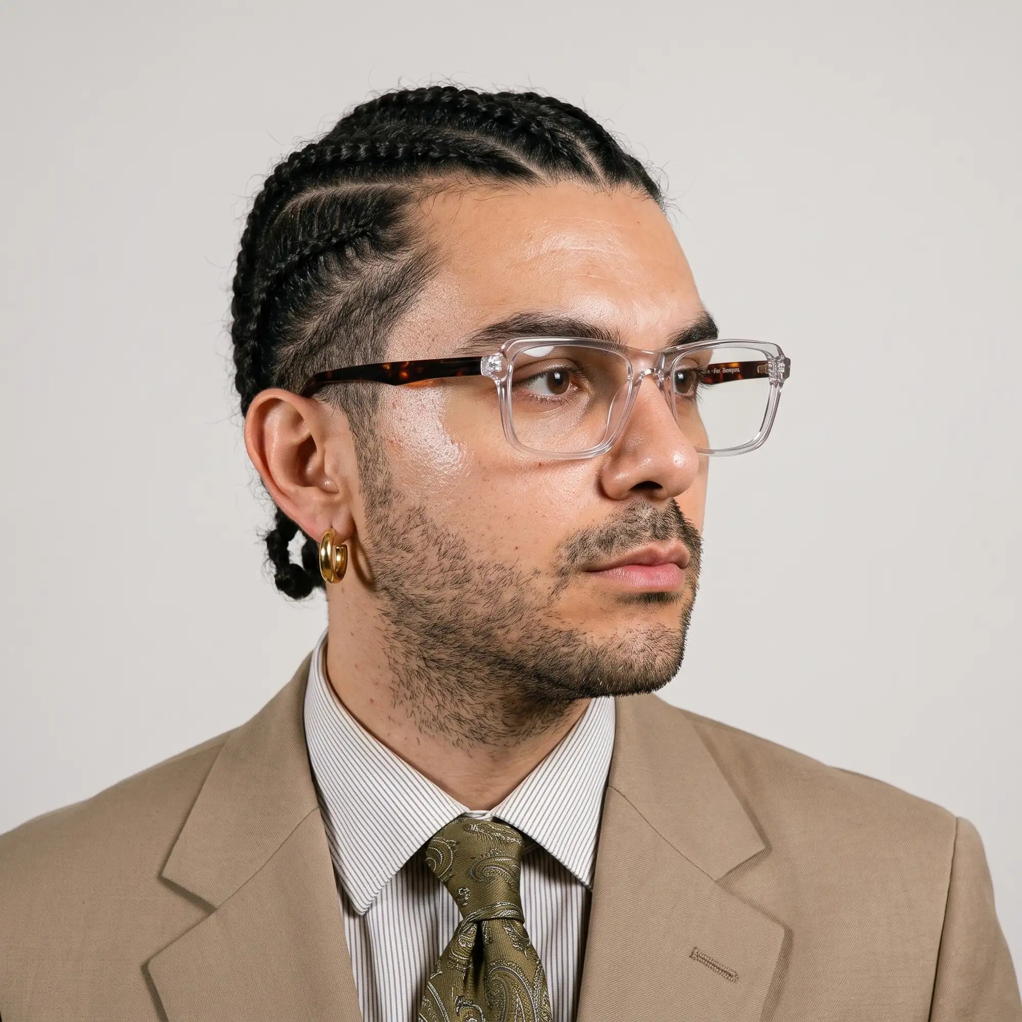 Fiore 1038 eyeglasses in transparent, worn by a model – campaign portrait, clean beige studio three-quarter portrait