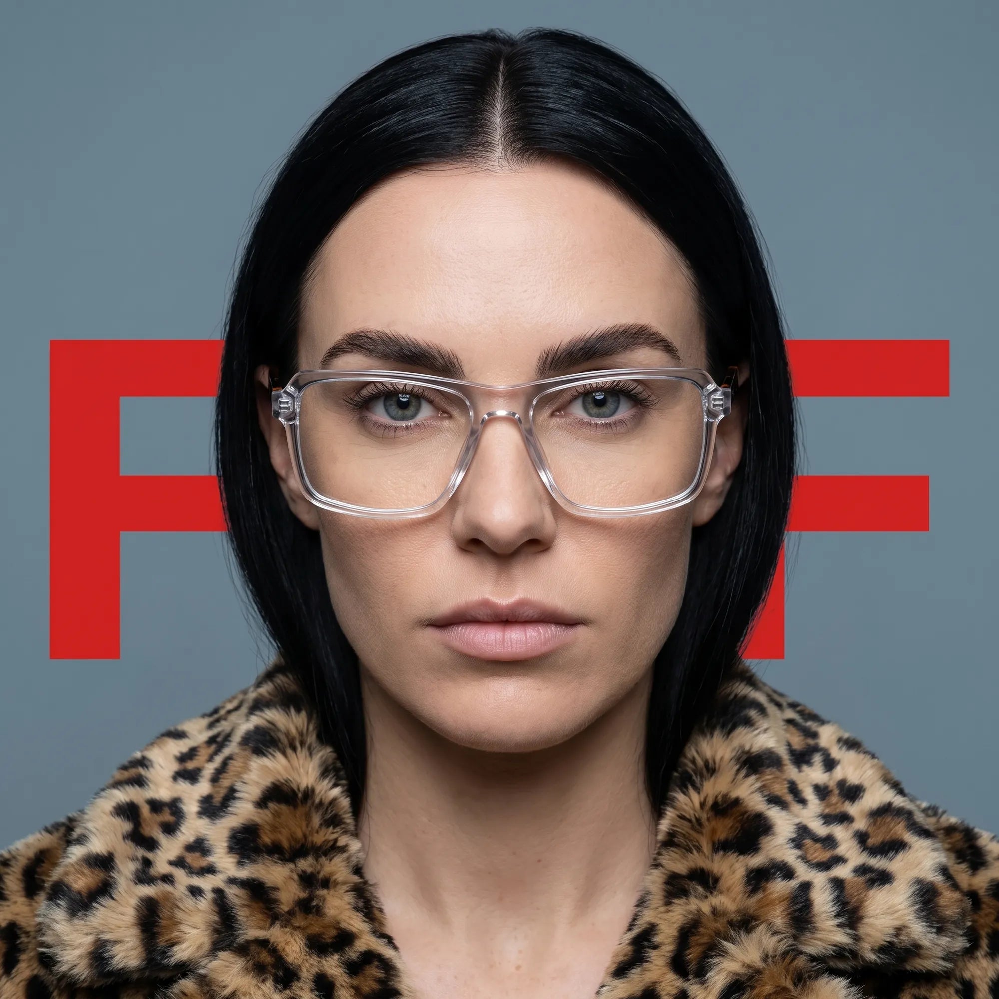 Fiore 1038 eyeglasses in transparent, worn by a model – campaign portrait, studio portrait with sculptural styling