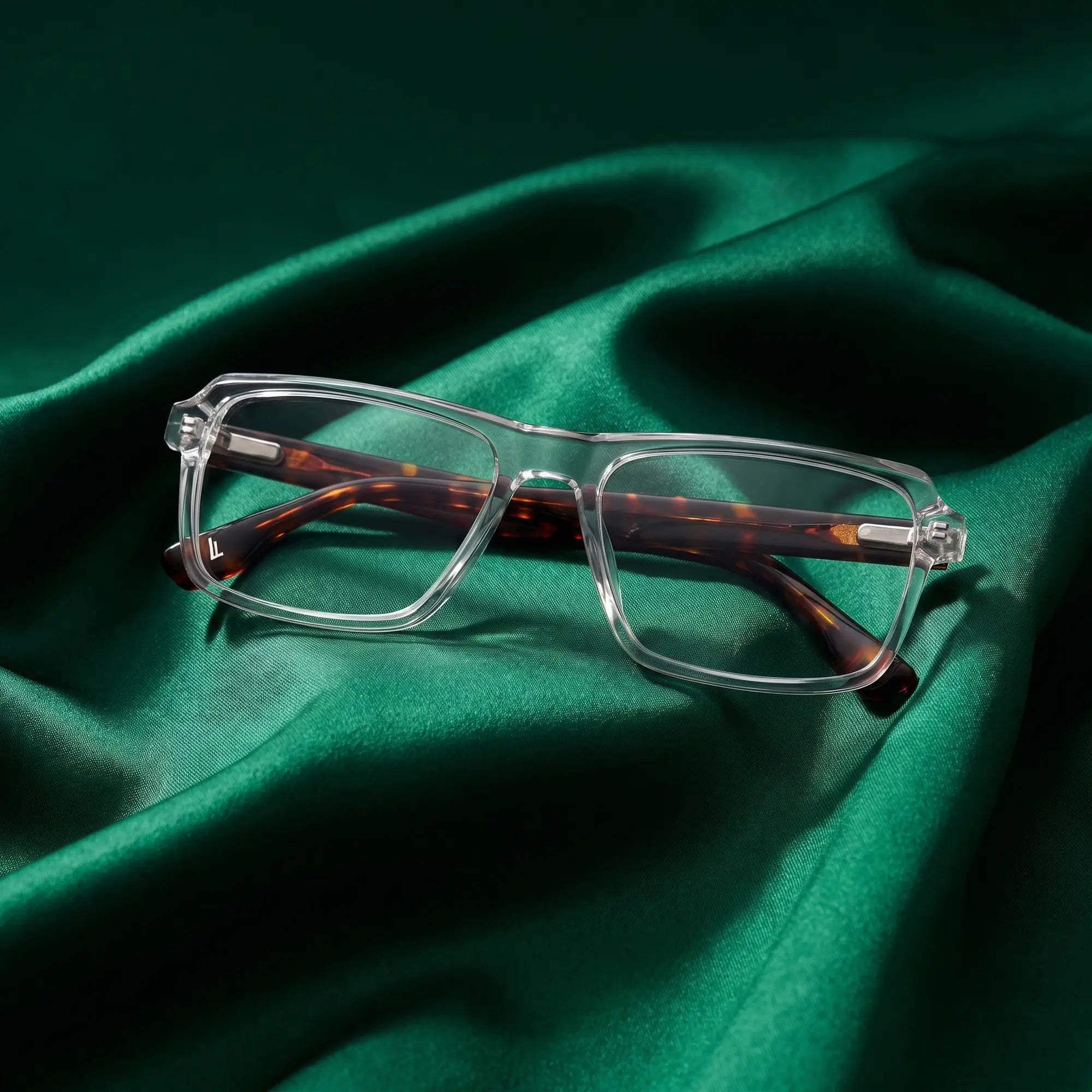 Fiore 1038 eyeglasses in transparent – nested in flowing emerald silk