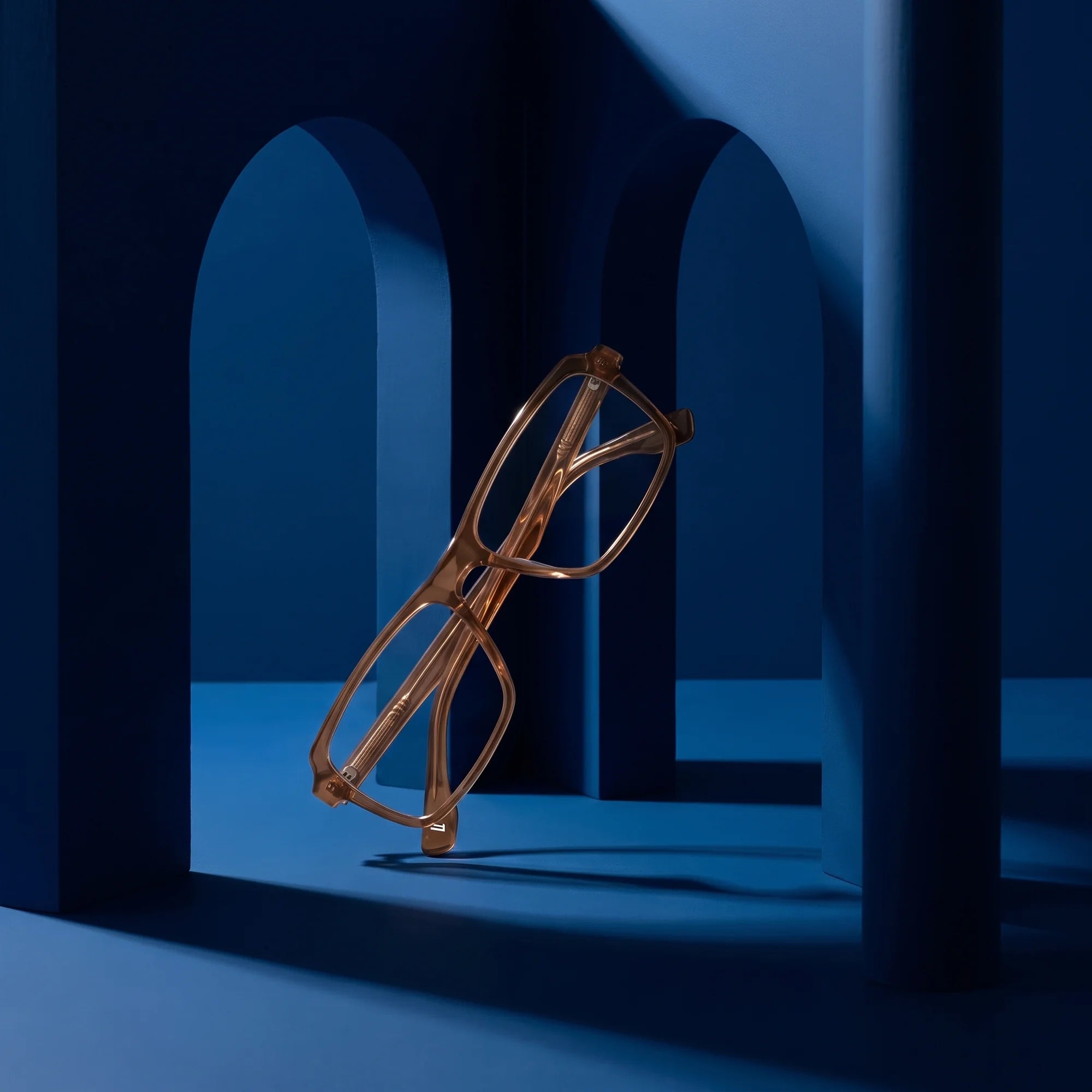 Fiore 1038 eyeglasses in brown – still life among monochrome midnight blue arches