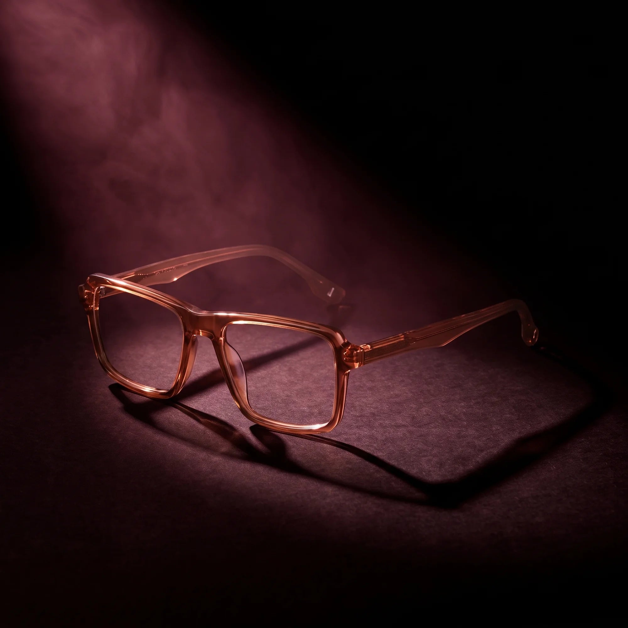 Fiore 1038 eyeglasses in brown – under a theatrical beam of light