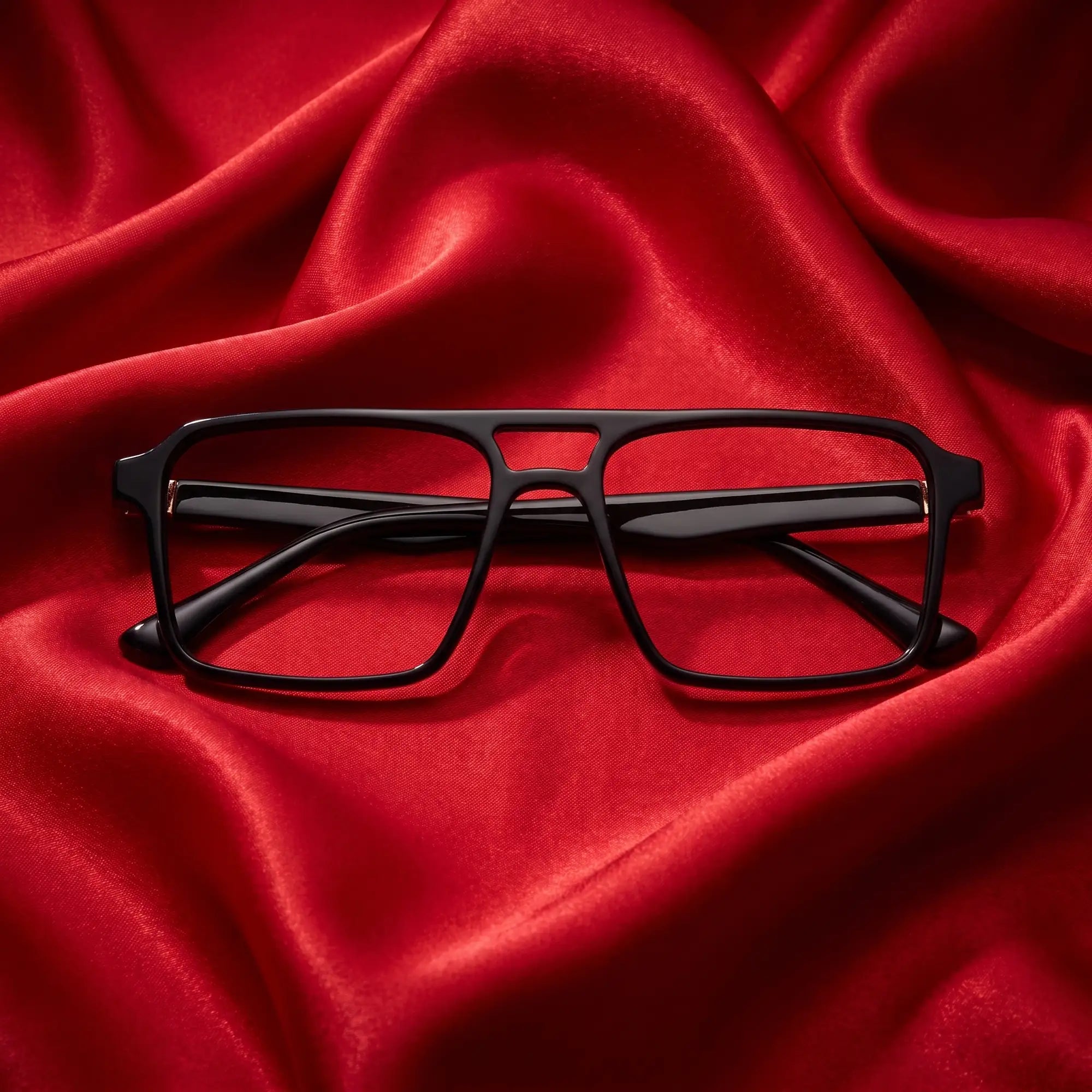 Fiore 1039 eyeglasses in black – nested in flowing vivid red silk