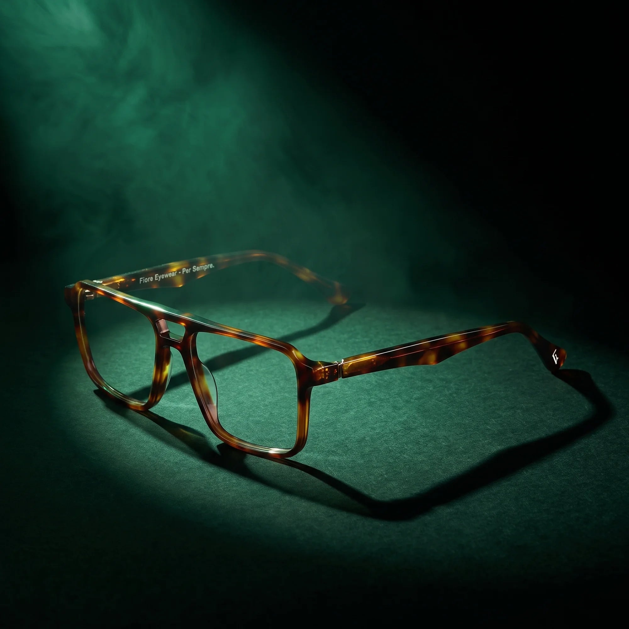 Fiore 1039 eyeglasses in tortoiseshell – under a theatrical beam of light