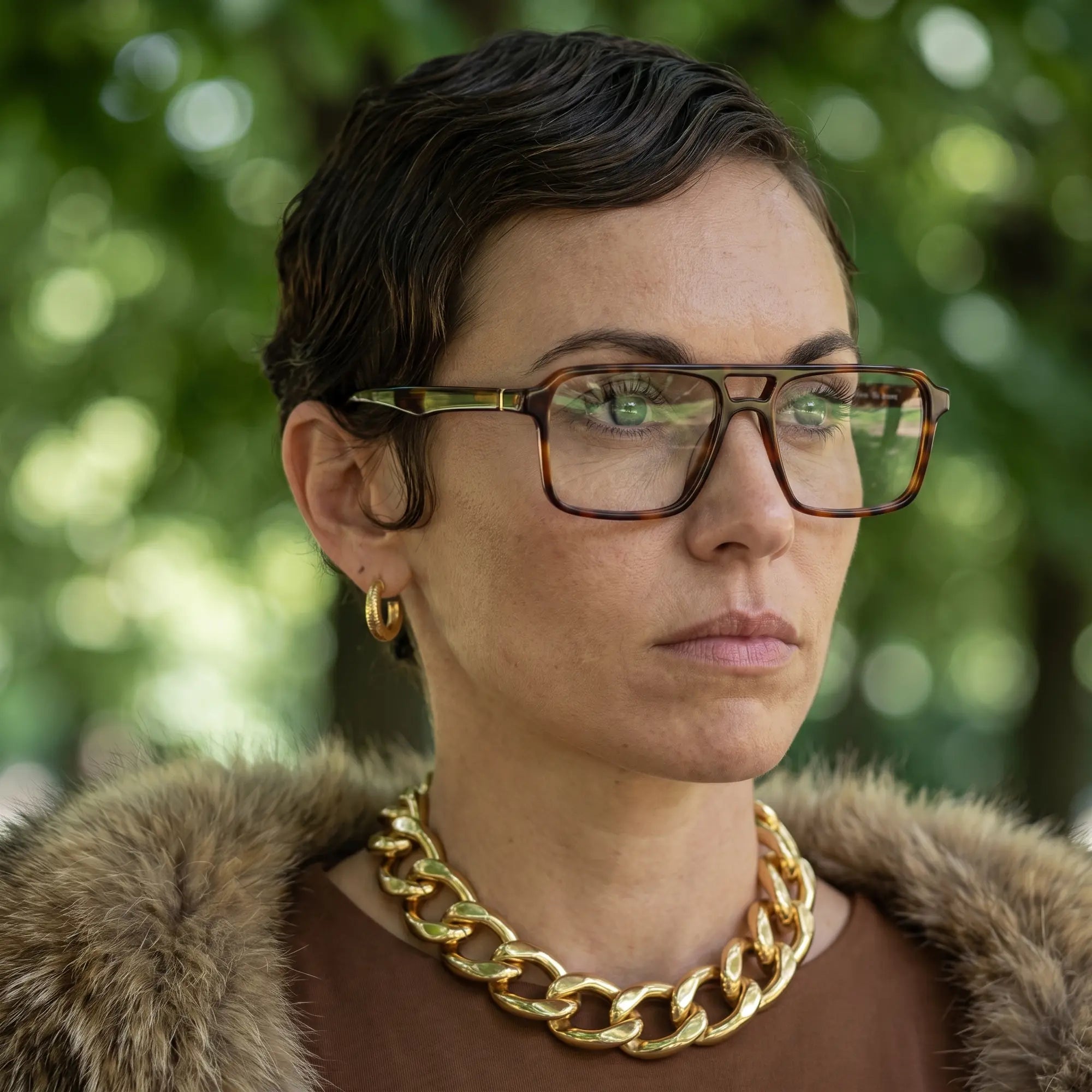 Fiore 1039 eyeglasses in tortoiseshell, worn by a model – campaign portrait, fur-collar portrait in dappled daylight