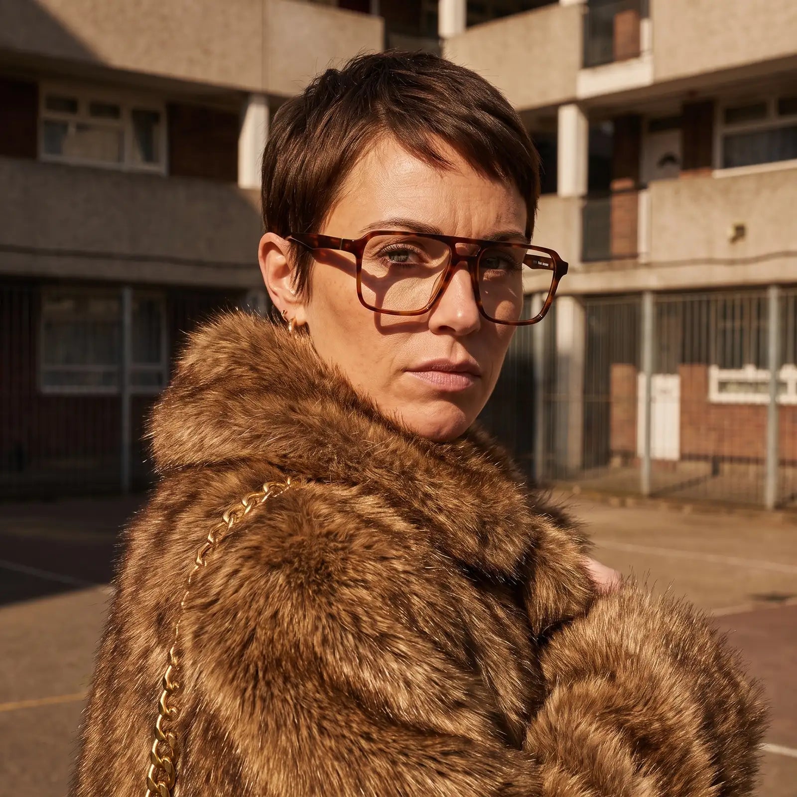 Fiore 1039 eyeglasses in tortoiseshell, worn by a model – campaign portrait, street portrait rooted in city heritage