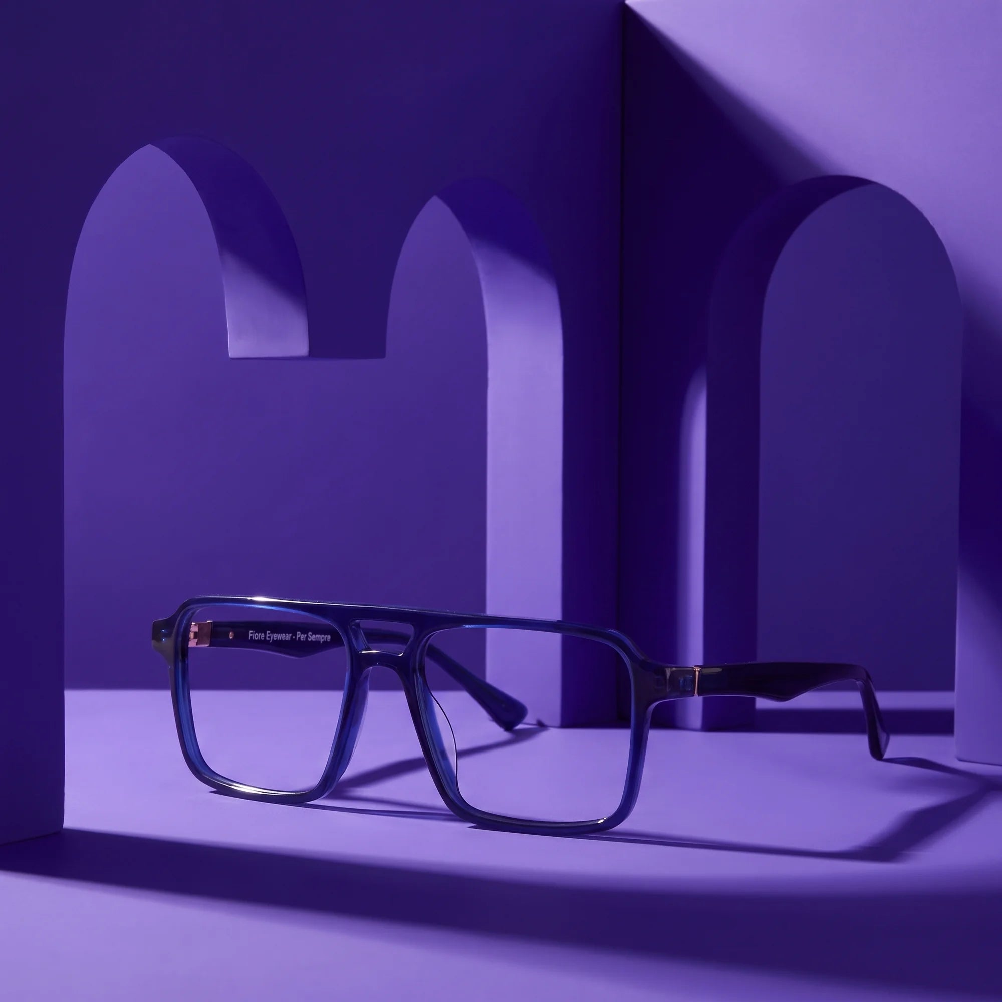 Fiore 1039 eyeglasses in blue – staged on a sculptural violet architecture set