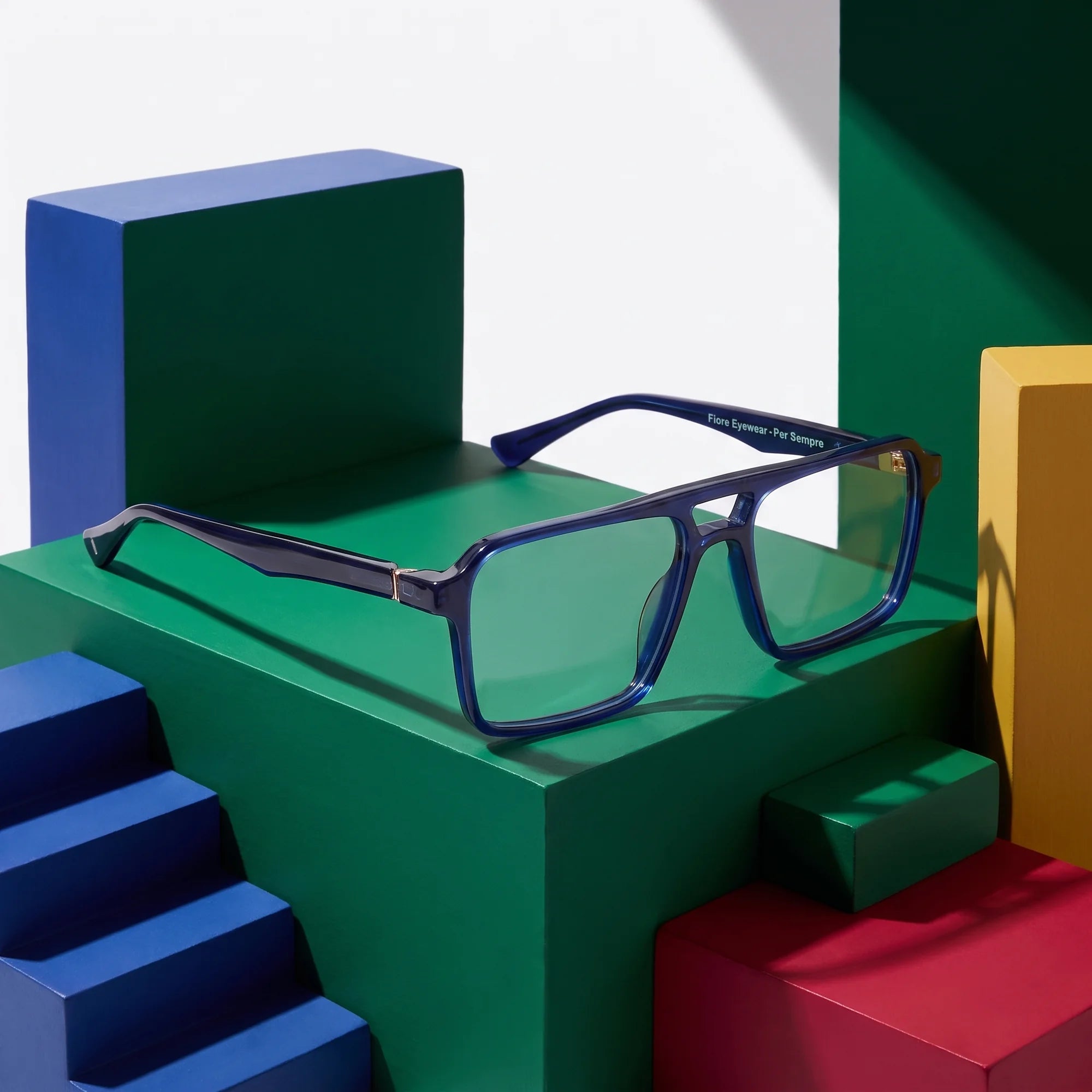 Fiore 1039 eyeglasses in blue – on bold primary color-block steps